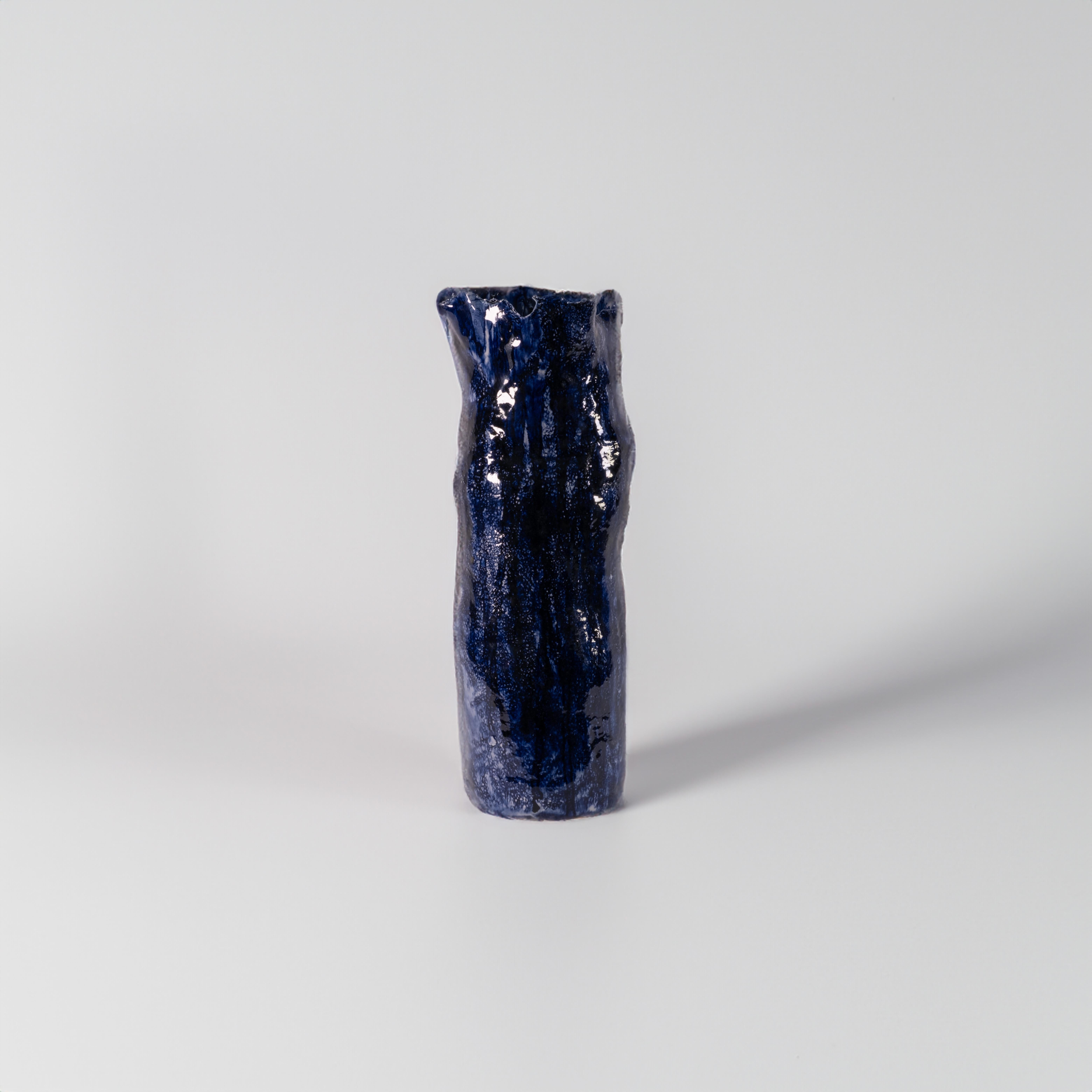 Alex Muradian's ceramics capture the essence of his experiences in both the English countryside and the coastal beaches where he currently resides. Each piece is handbuilt, showcasing the artist's devotion to craftsmanship. The glazes employed by