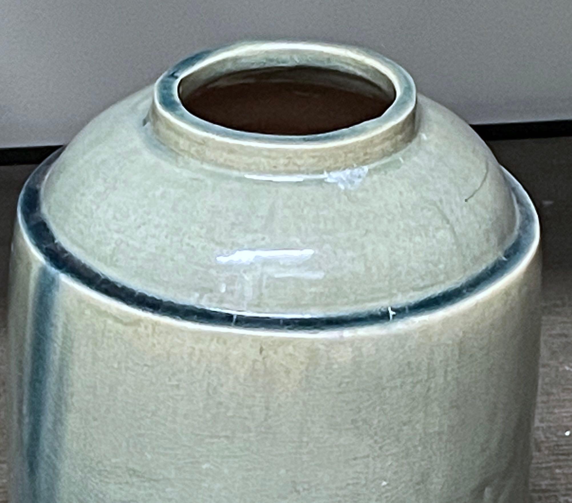 Contemporary Chinese washed turquoise glazed vase.
The glaze gives the vase the appearance of a weathered look.
Cylinder shape.
Three available.