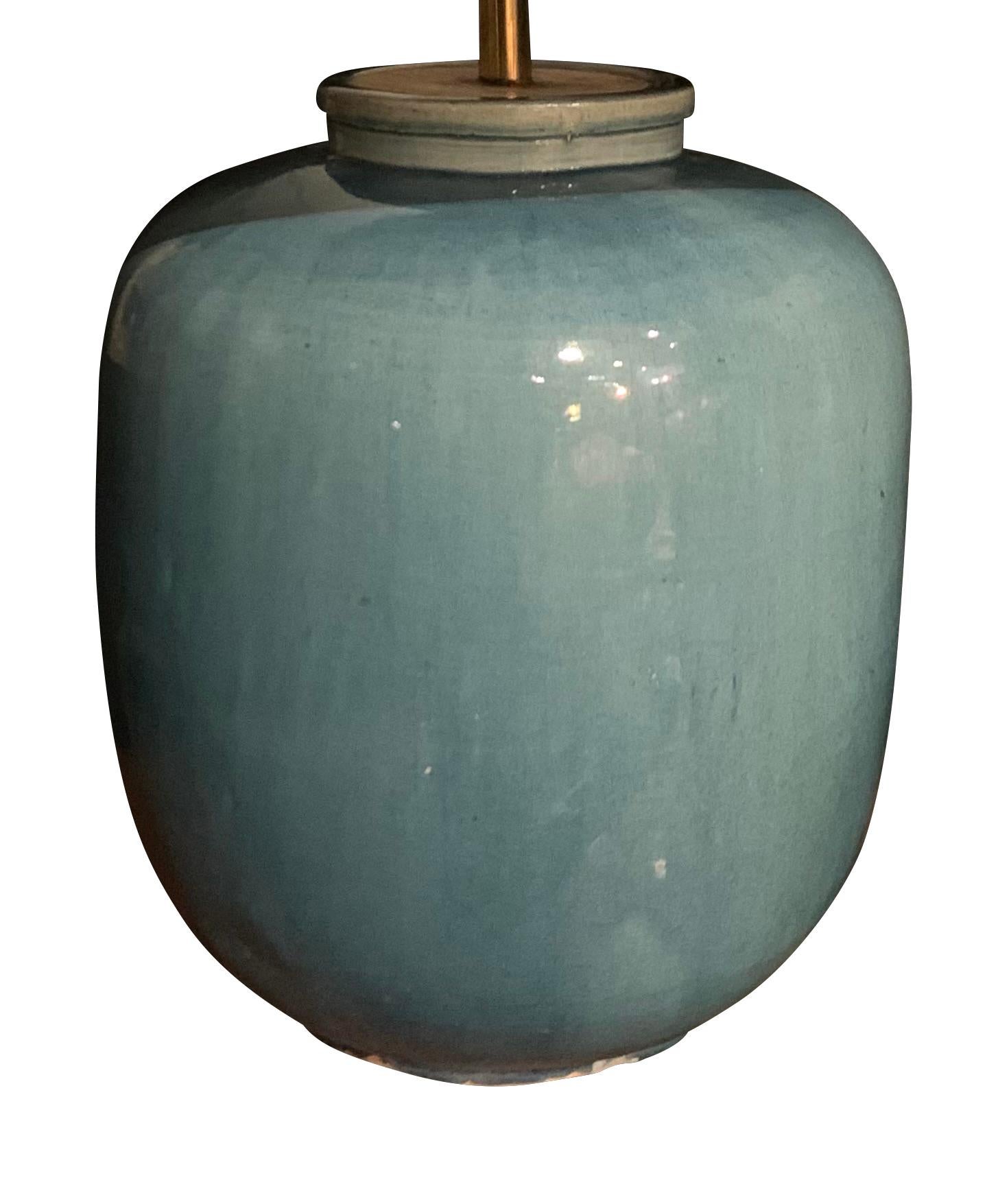 Contemporary Chinese pair of washed turquoise glazed lamps.
Barrel shaped base measures 9