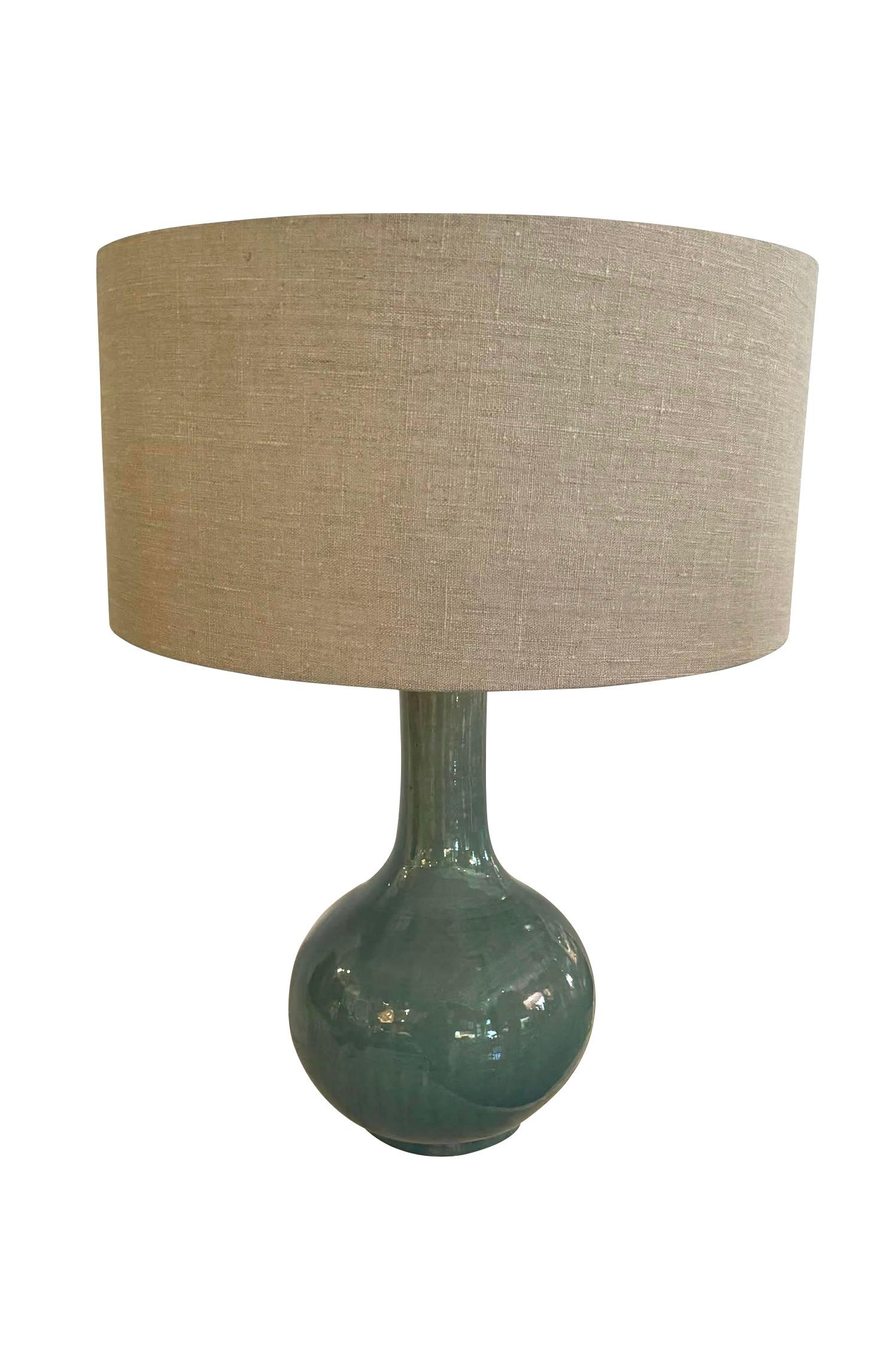 Contemporary Chinese pair of funnel neck washed turquoise glazed lamps.
New Belgian linen shades diameter 19.5