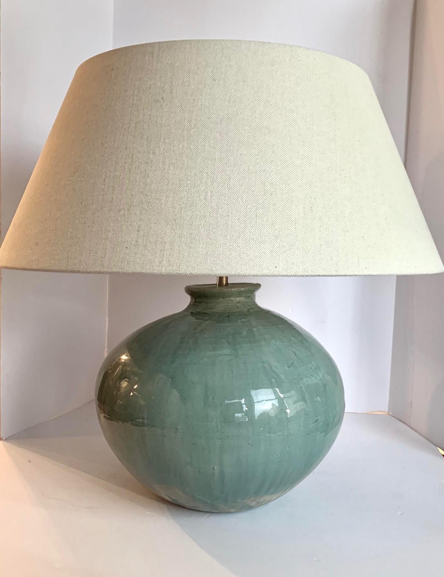 Contemporary Chinese pair of washed turquoise lamps.
The turquoise glaze has the appearance of being washed. This gives the finish slightly varied degrees of the turquoise color.
Round 