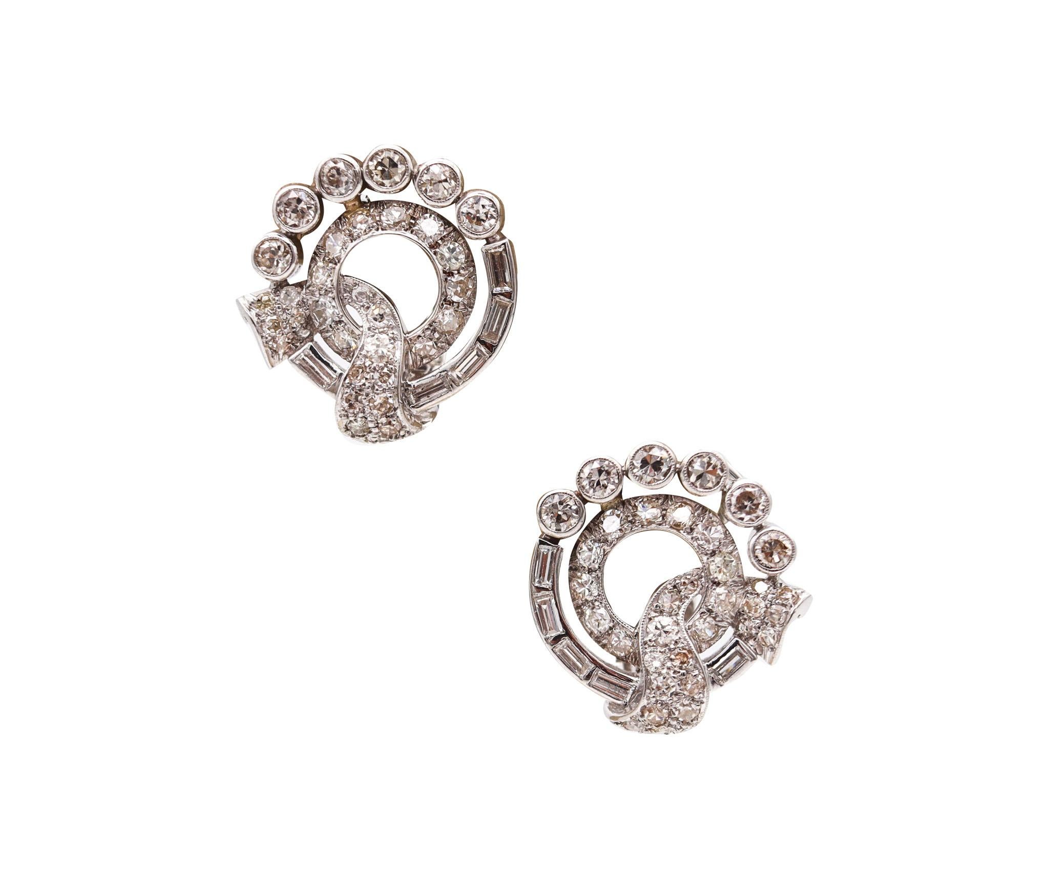 Art deco platinum clips-on earrings designed by Waslikoff & Sons

This is a stunning antique pair of clips-on earrings, created in America during the art deco period, back in the 1930. The pair of earrings was crafted by Waslikoff & Sons in solid