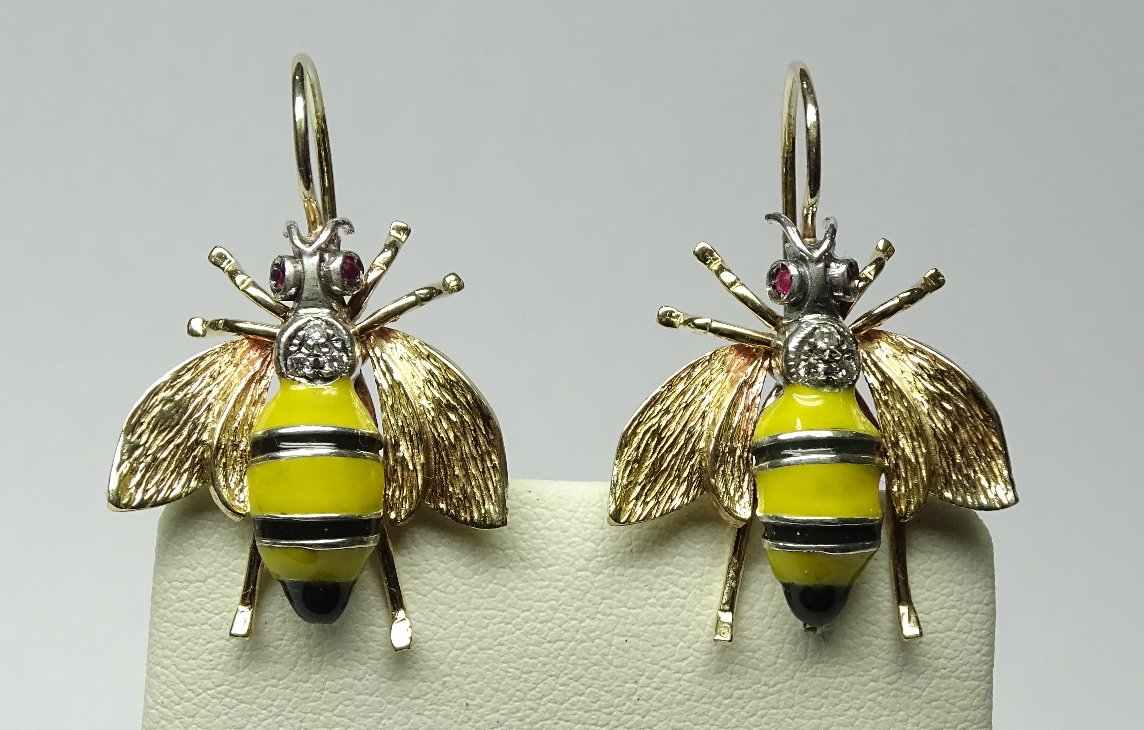 These Earrings are made of 9K Yellow Gold and Sterling Silver.
These Earrings have 0.08 Carats of Round Cut White Diamonds.
These Earrings have 0.14 Carats of Rubies.
These Earrings have Yellow and Black Enamel
These Earrings are inspired by Art