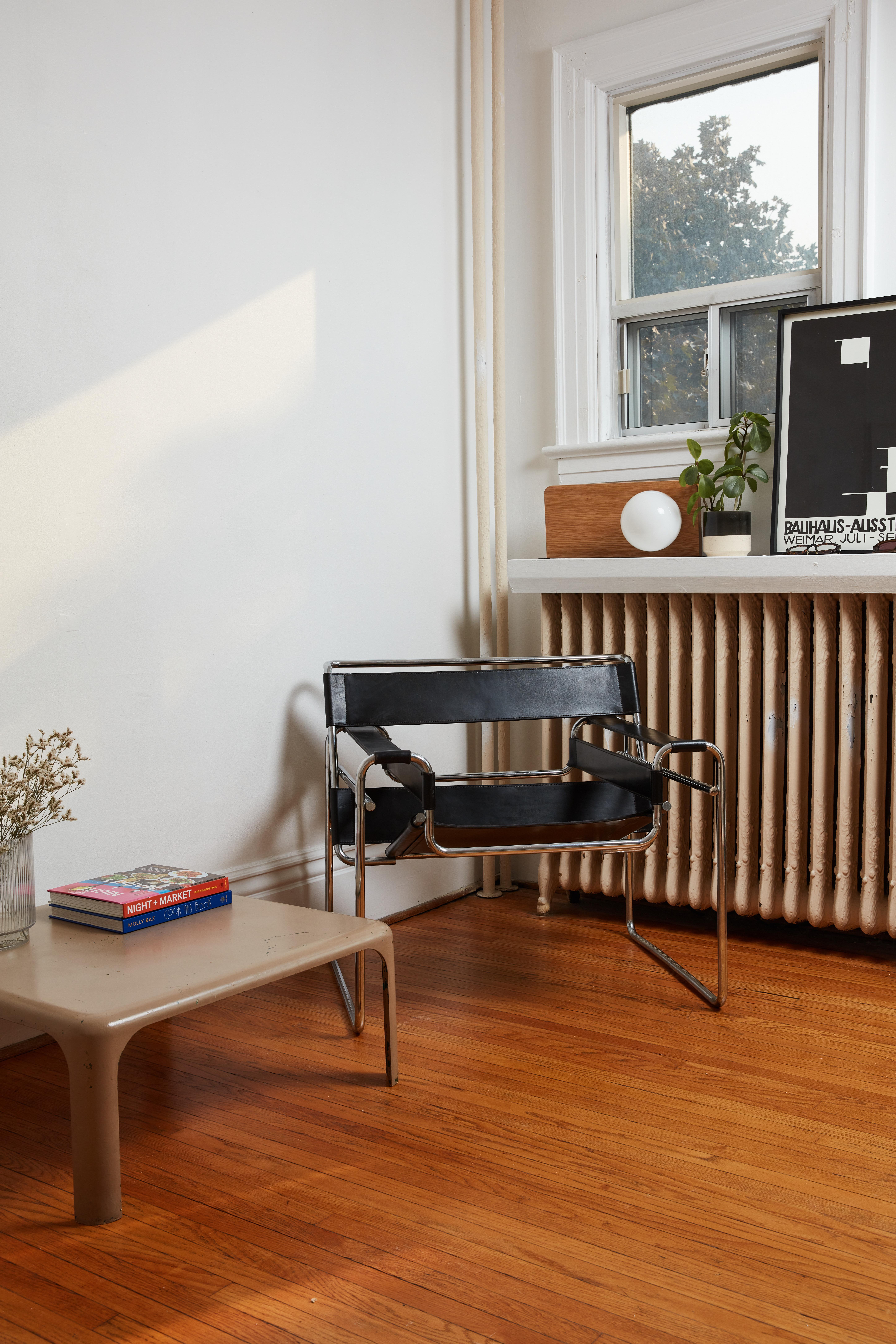 This Wassily Chair, designed by Marcel Breuer during his time at the Bauhaus, is an icon of modern design and of minimalist design. With its signature chrome-plated tubular frame and artfully arranged leather straps, this piece has been an enduring