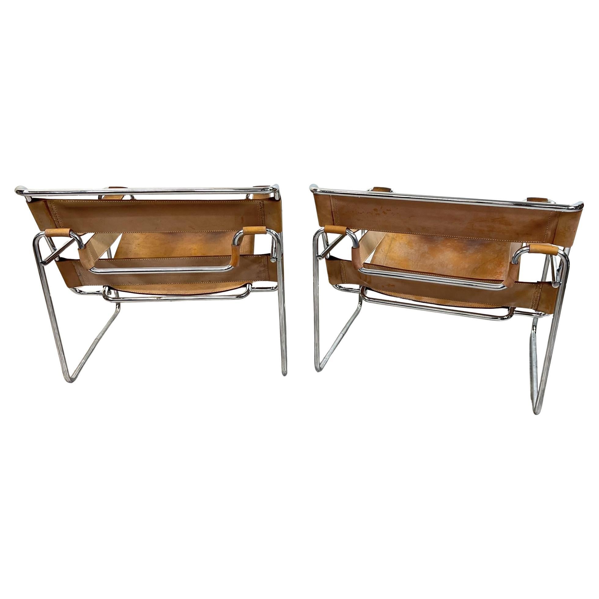 Pair of Vintage Marcel Breuer Style Wassily Sling Chairs. Chairs were designed in 1925 by Hungarian architect and designer Marcel Breuer (1902-1981), and reflect the Bauhaus School principles of simplicity, functionality and the use of modern