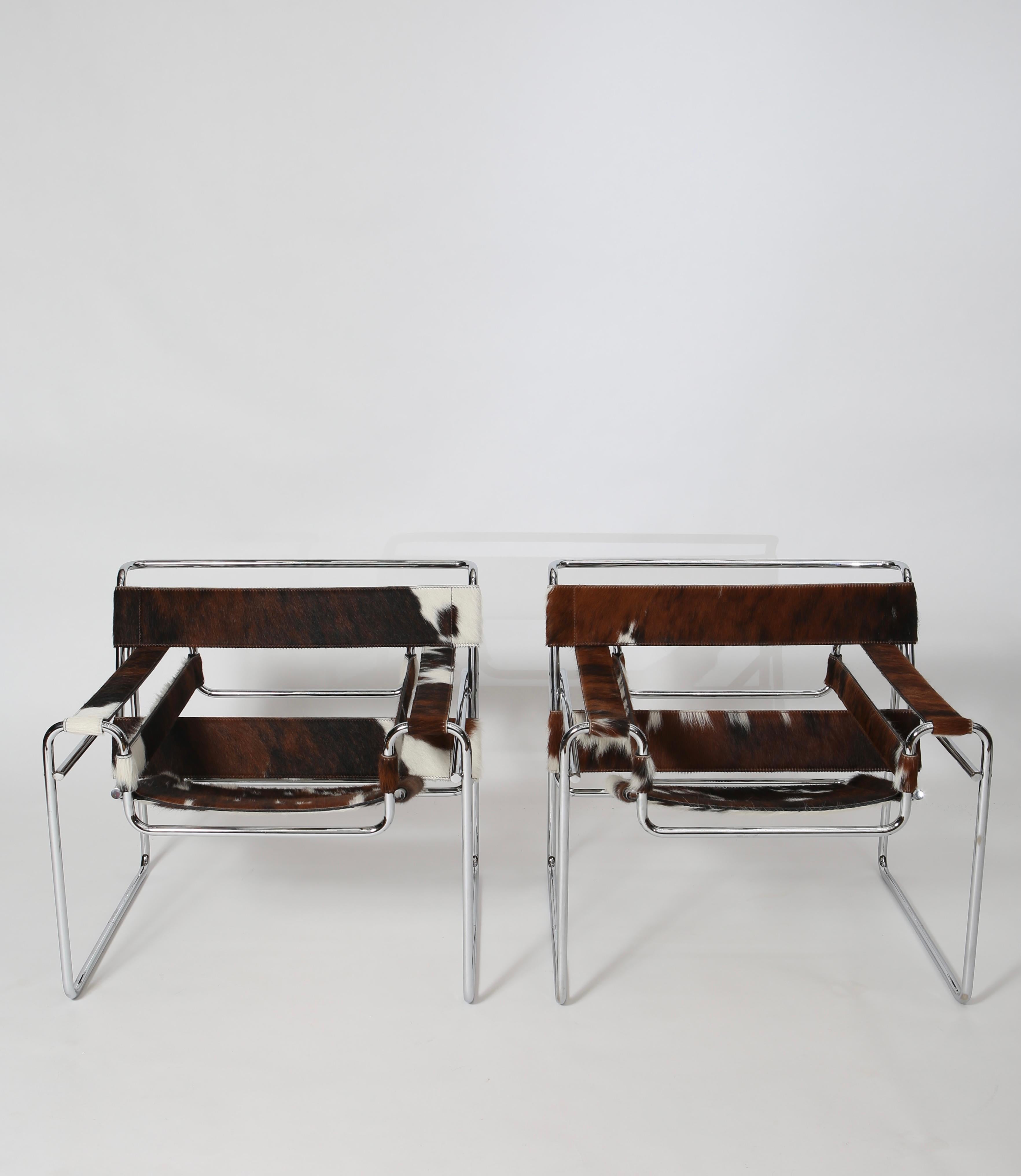 Iconic chairs by Marcel Breuer made by Knoll. Brown and white hair-on calf hide slings. Immaculate condition; produced circa 2000.
Sold as pair.