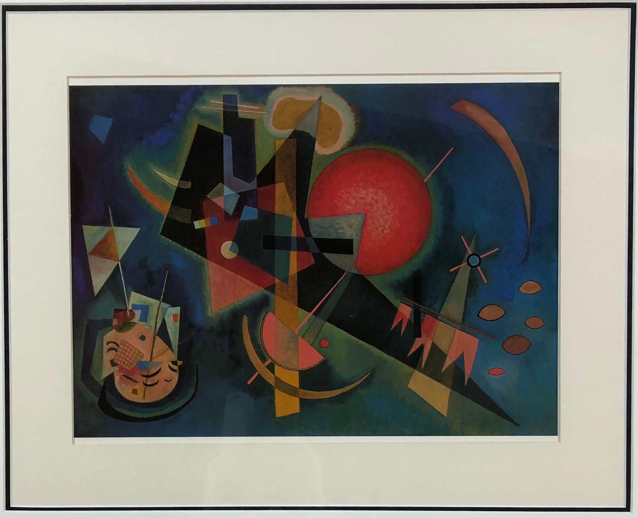 Wassily Kandinsky print professionally framed. 
Titled: In The Blue, original painted in 1925, a variety of geometrically inspired forms balanced on a gigantic scale within the dark blue field.

This is a cut-out from the 1990 edition published