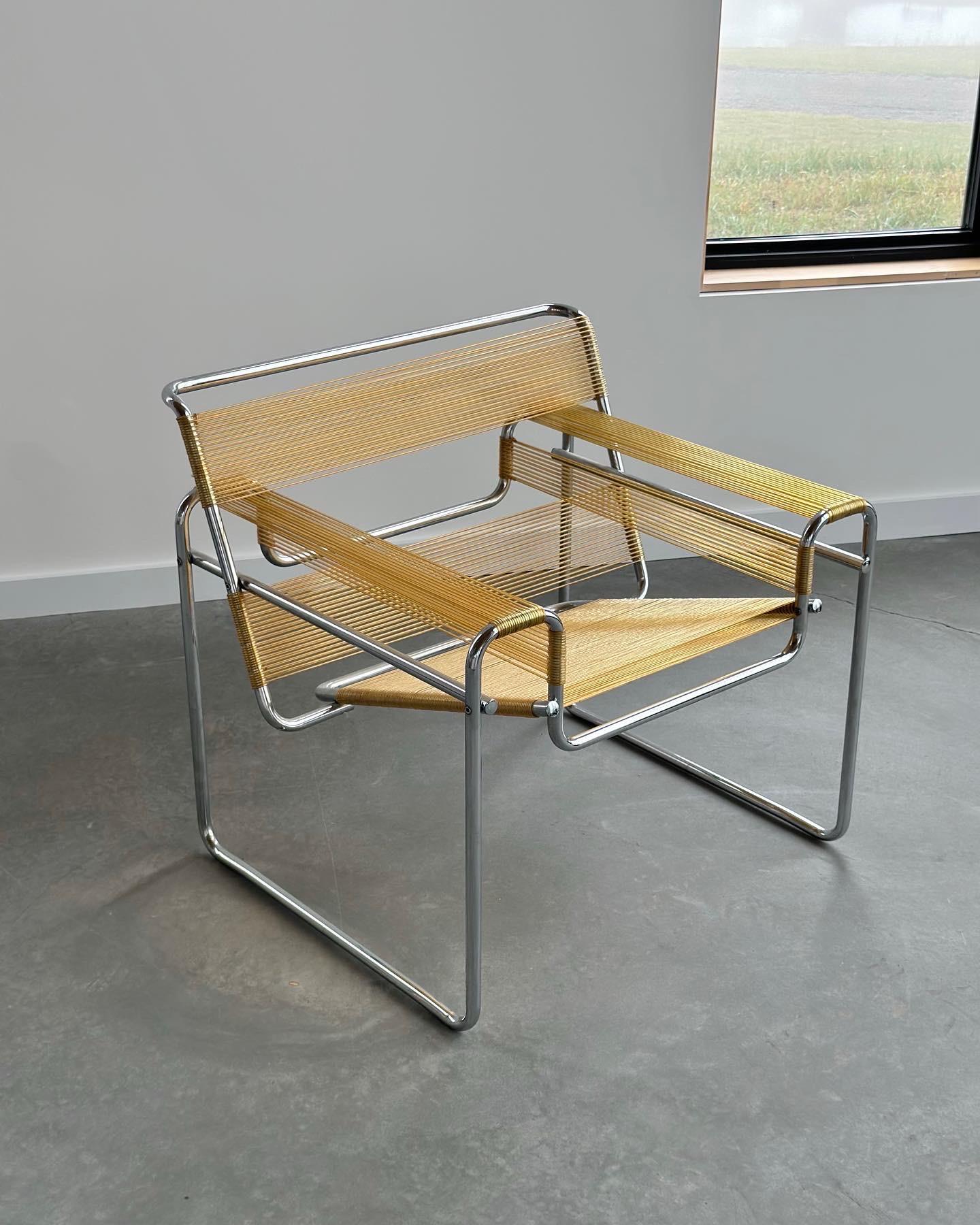 Incredibly cool spaghetti cord rendition of the Marcel Breuer's Wassily, a classic and iconic piece of furniture that blends style and functionality. The chair features a sleek and minimalist design, with a frame made from polished chrome steel and
