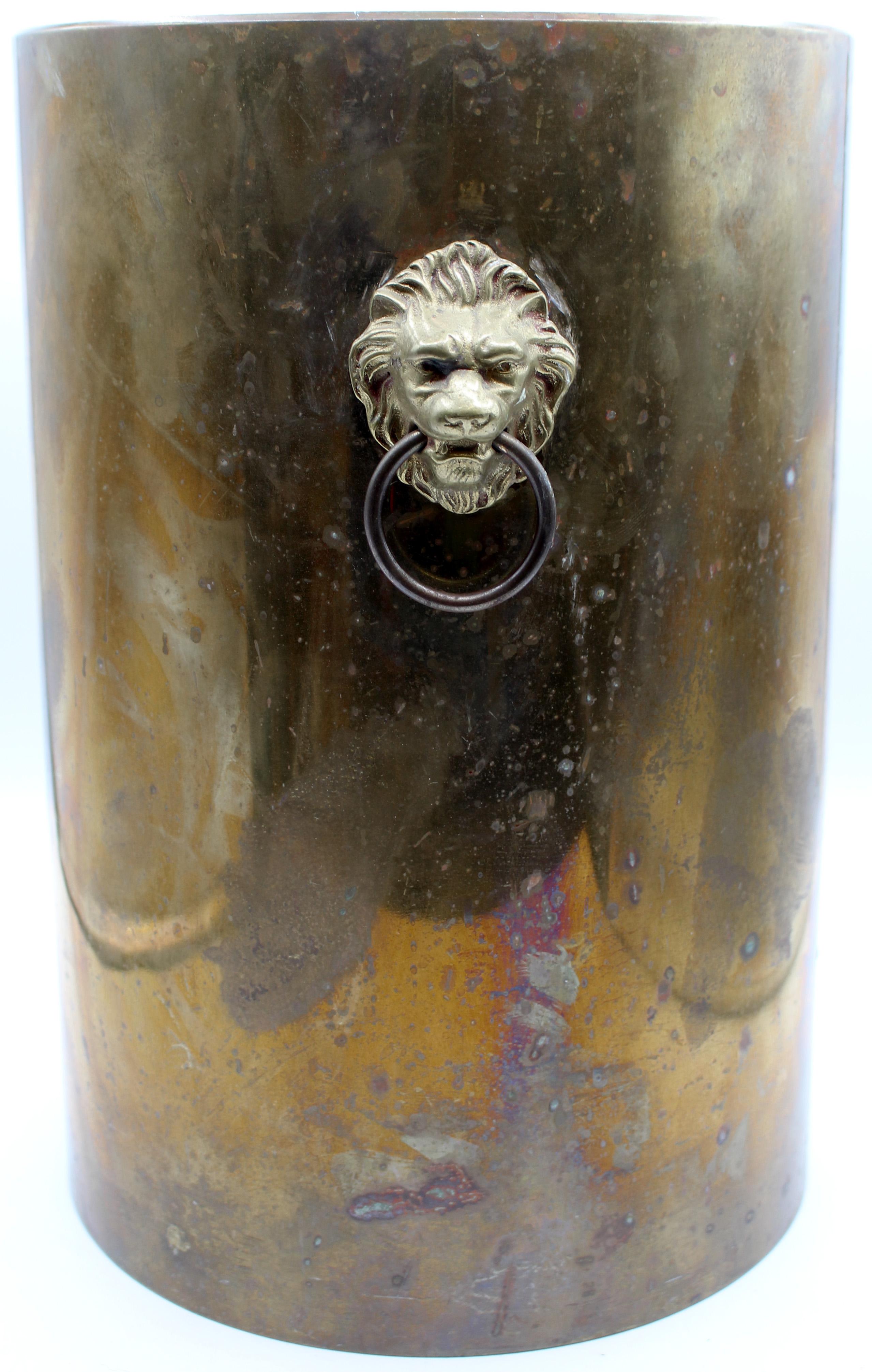 English WWI brass artillery gun shell now a waste basket. From large scale artillery, now with wooden bottom & lion mask handles for use as a waste basket.
11.25