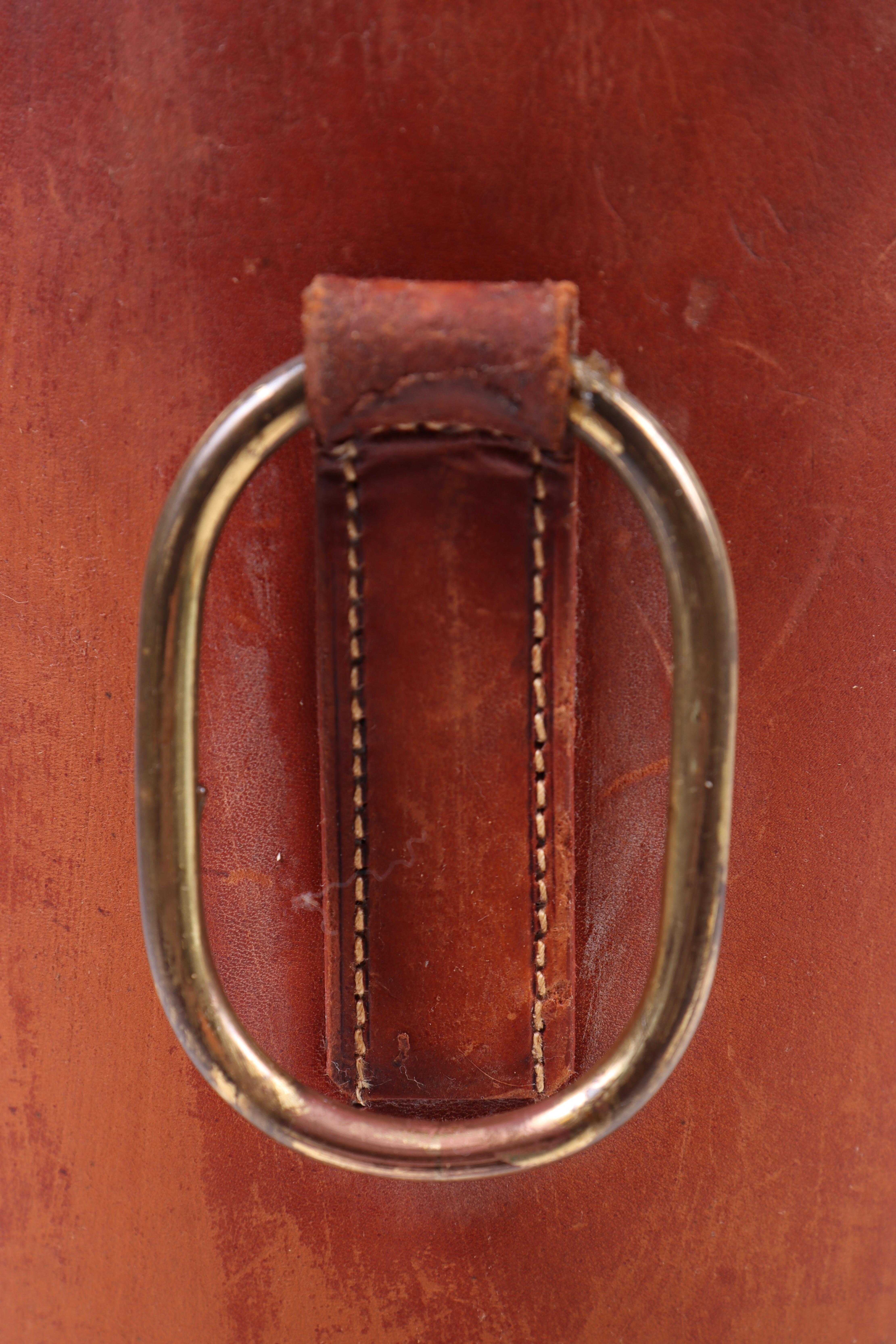 Waste bin in beautifully patinated leather and brass. Made for Illums Bolighus in the 1950s. Great original condition. Made in Denmark.