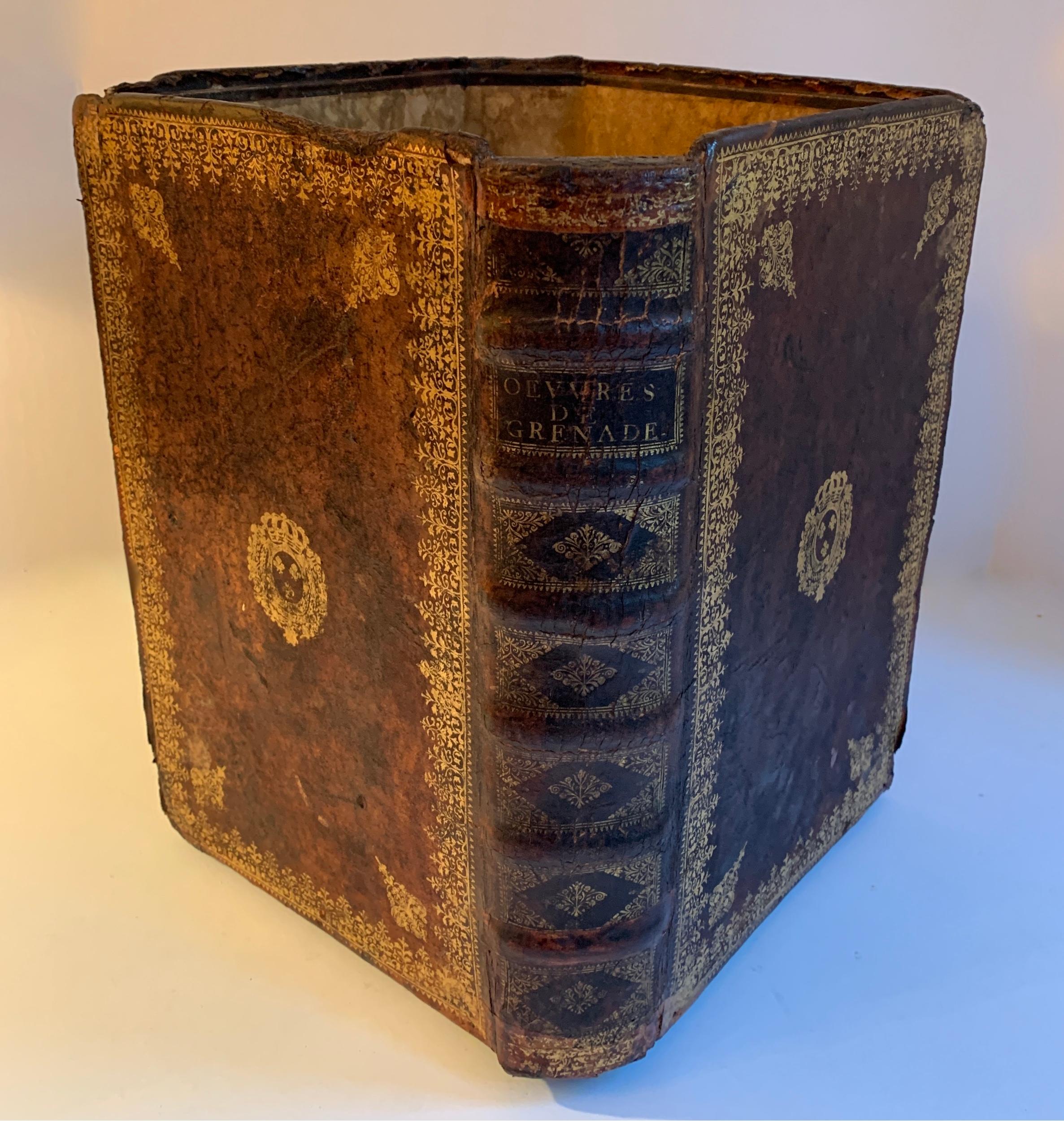 A handmade leather waste bin made of vintage leather bound books. The bin is quite large and substantial for next to a desk in your den, library of office. A trash can never looked better or more attractive than this - we have found several and they