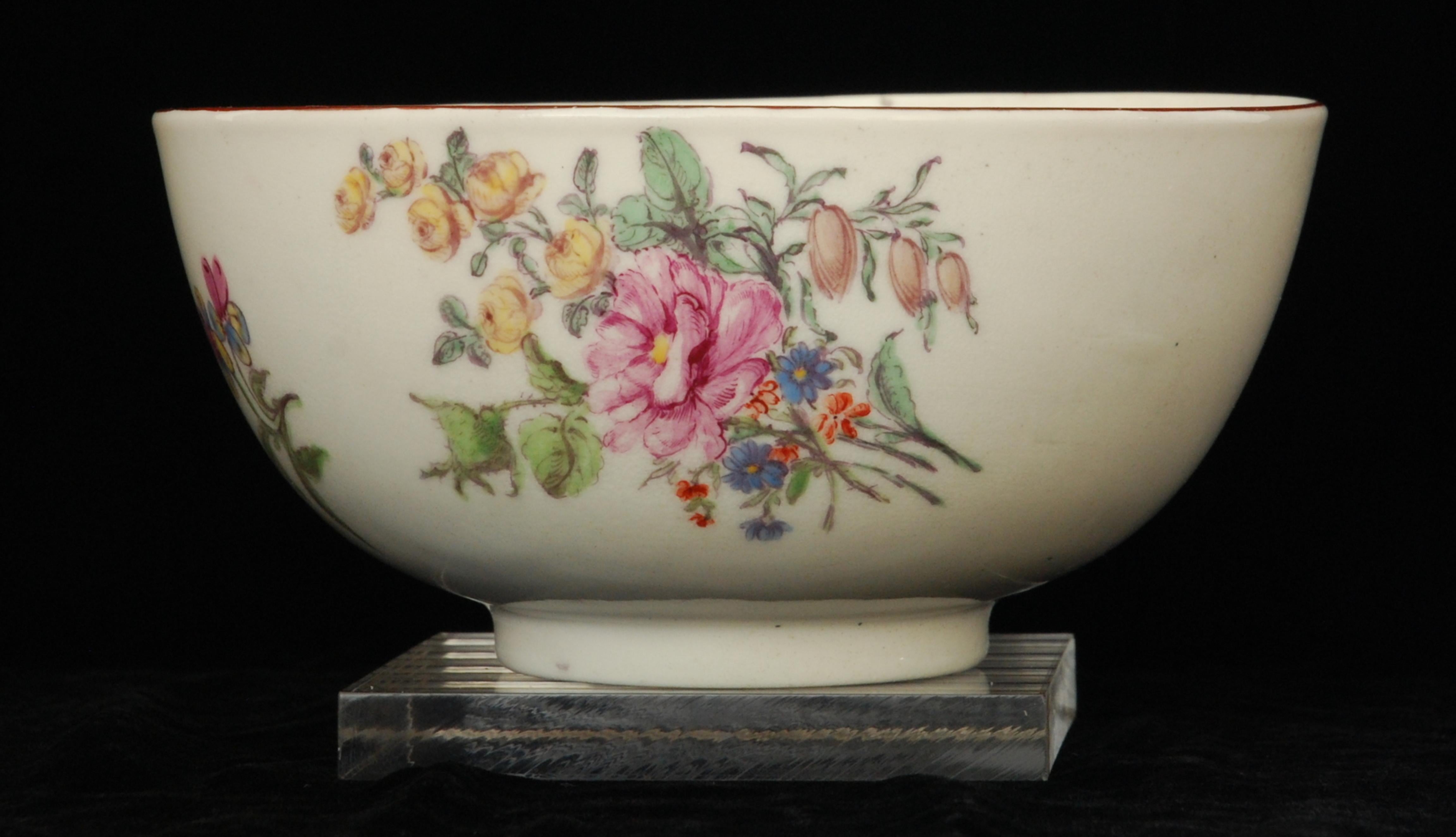 An unusual waste bowl (sometimes called a slop bowl) in soft-paste porcelain, decorated with typical Chelsea sprigs and bunches of flowers.

One of the most distinctive features of Chelsea porcelain is its intricate floral painting, which often