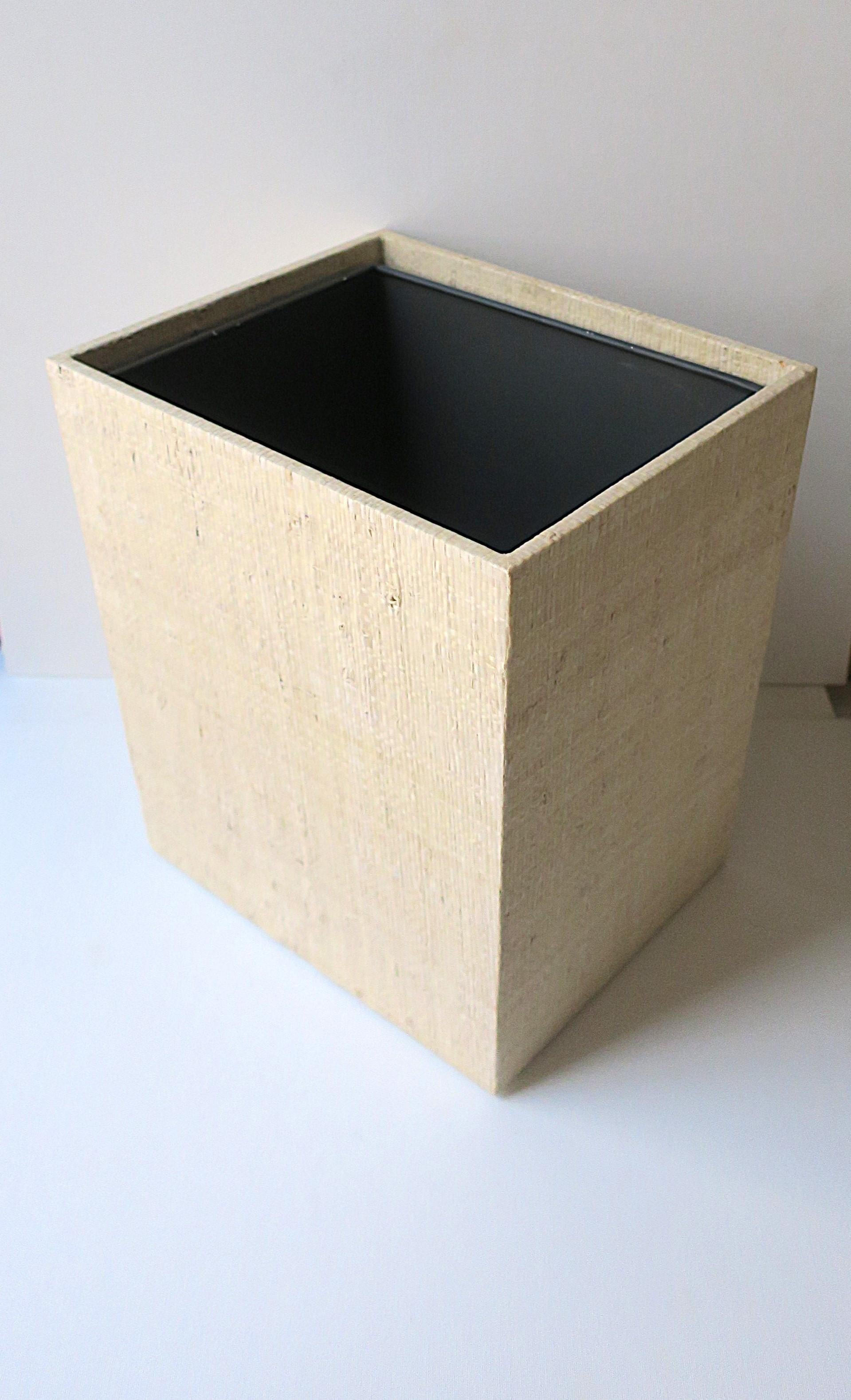A rectangular neutral colored (beige) grasscloth covered wastebasket or trash can with removable insert (shown in last image.) A great piece for a bathroom, powder room, home office, etc., many areas. Piece appears to have never been used.