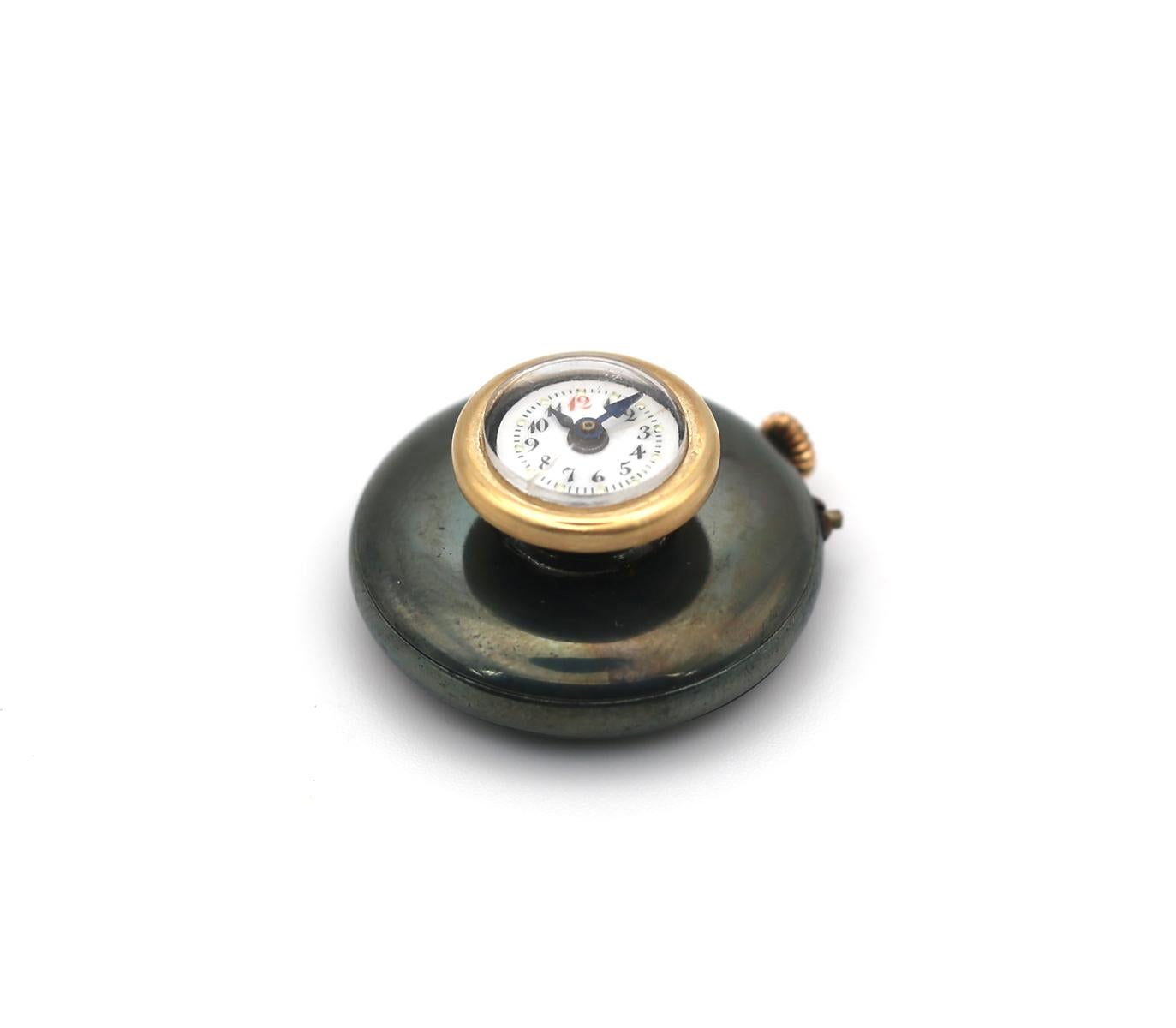 Watch Buttonhole Blued Steel, 1890

An amazing gadget from the late 19th century. White enamel with gold dots and Arabic numerals watch dial. This watch is supposed to be worn on a jacket buttonhole or a cufflink. The dial is inserted in a