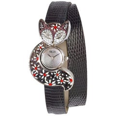 Montre en or blanc et diamants blancs avec bracelet en lézard et cadran guilloché décoré de micro-mosaïque