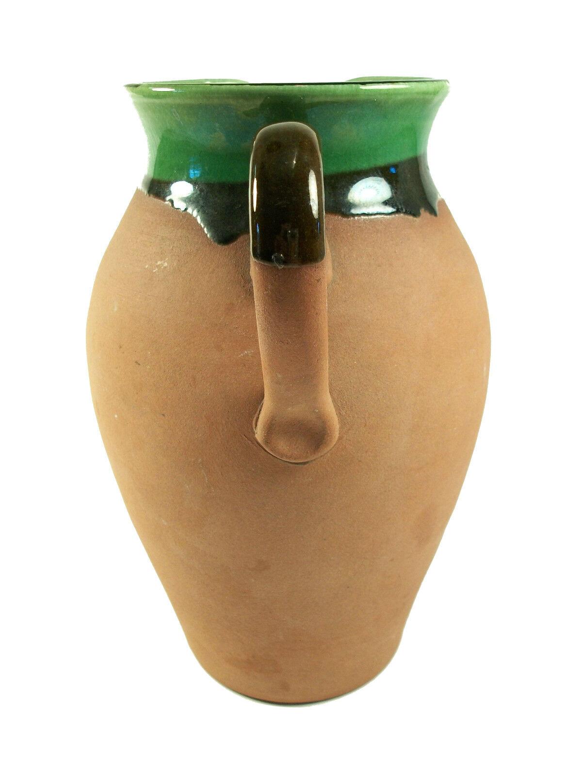 WATCOMBE TORQUAY - Vintage wheel thrown terracotta jug with glazed interior and lip - partially glazed handle - United Kingdom - mid 20th century.

Excellent vintage condition - no loss - no damage - no restoration.

Size - 5 3/4