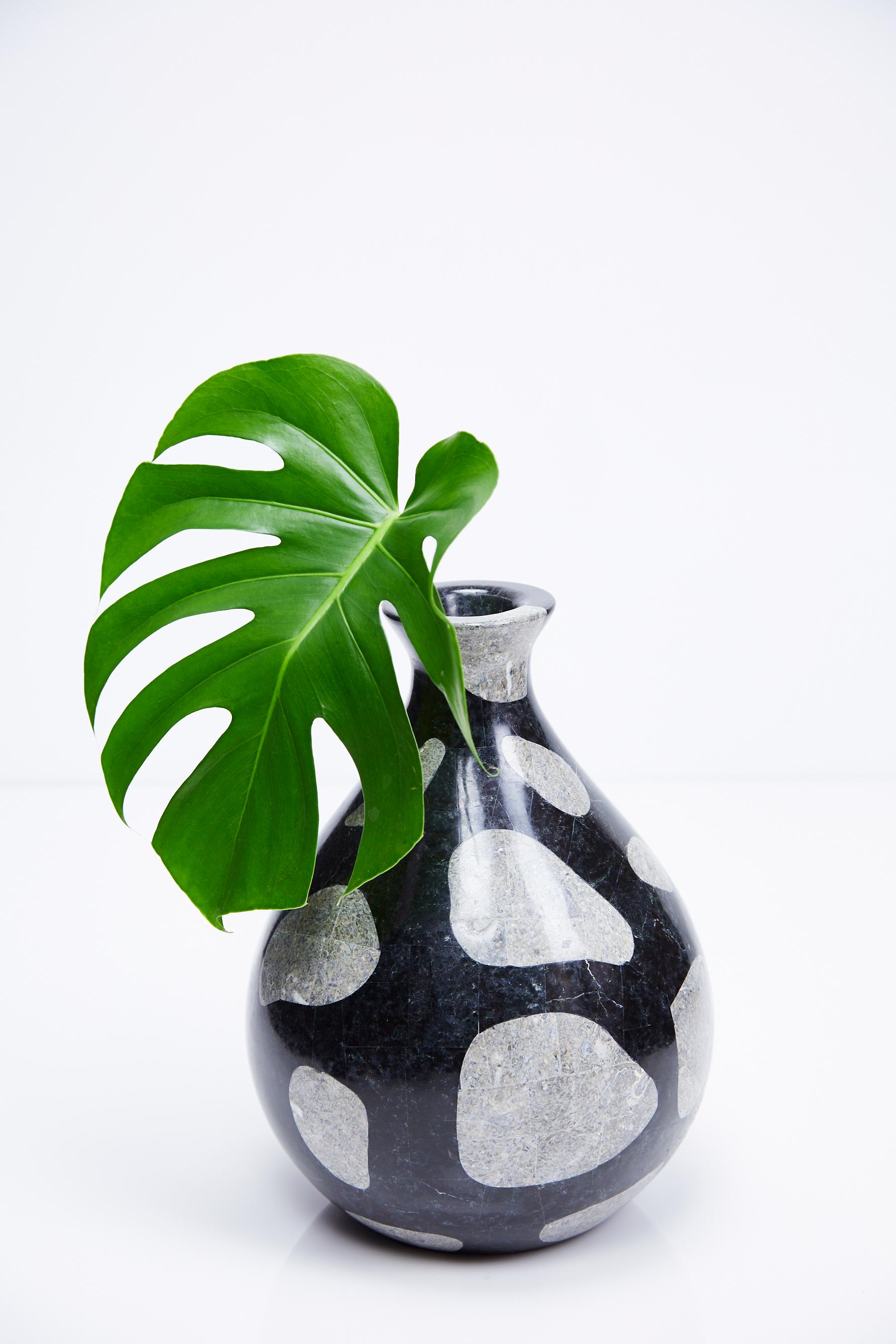 Teardrop shaped vase in tessellated black and cantor stone with spotted 'giraffe' decoration over fiberglass body.

All furnishings are made from 100% natural Fossil Stone or Seashell inlay, carefully hand cut and crafted piece-by-piece and