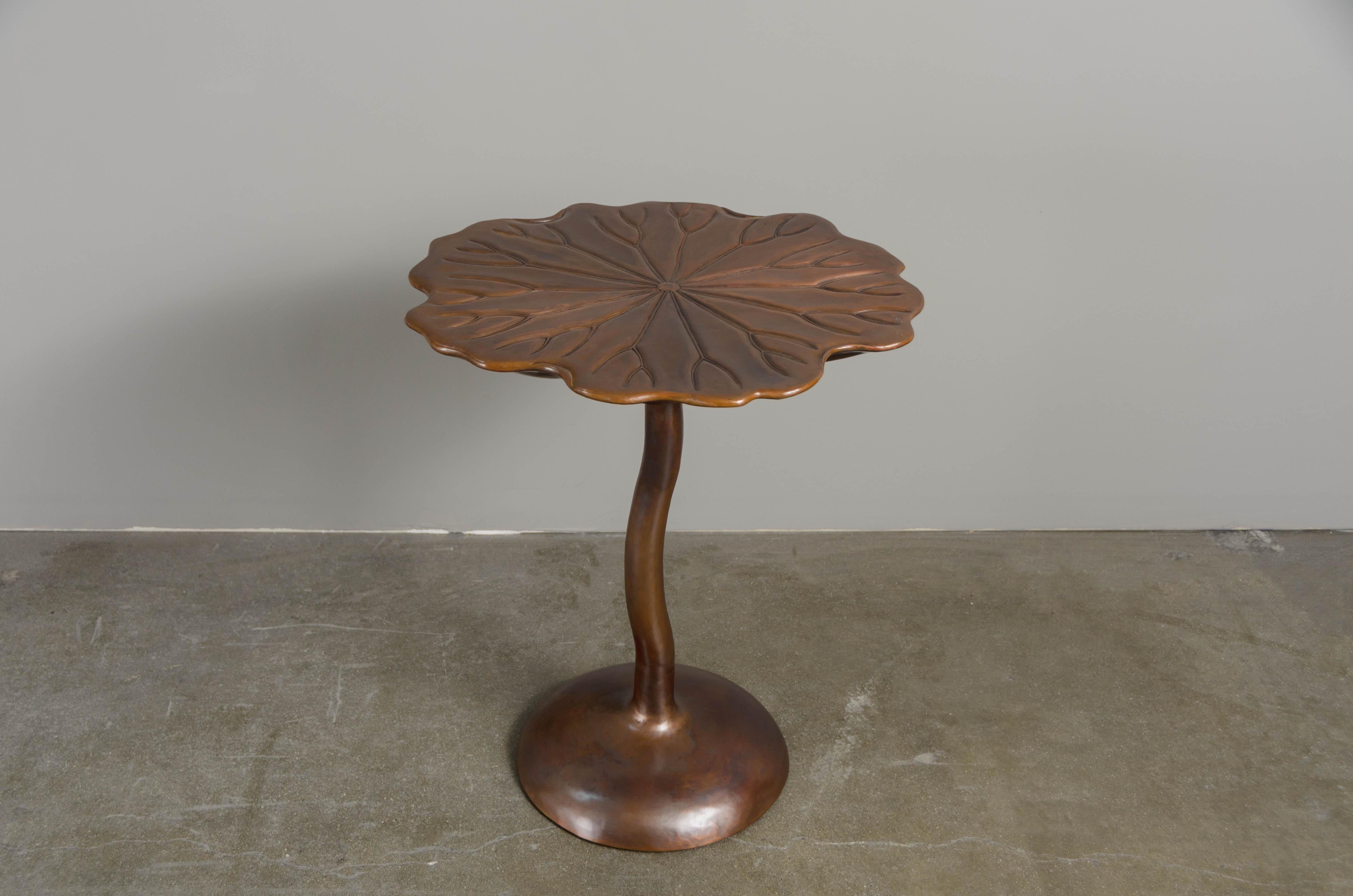 Water lily table
Antique Copper 
Hand Repoussé
Limited Edition
Contemporary
Each piece is individually crafted and is unique. 

Repoussé is the traditional art of hand-hammering decorative relief onto sheet metal. The technique originated