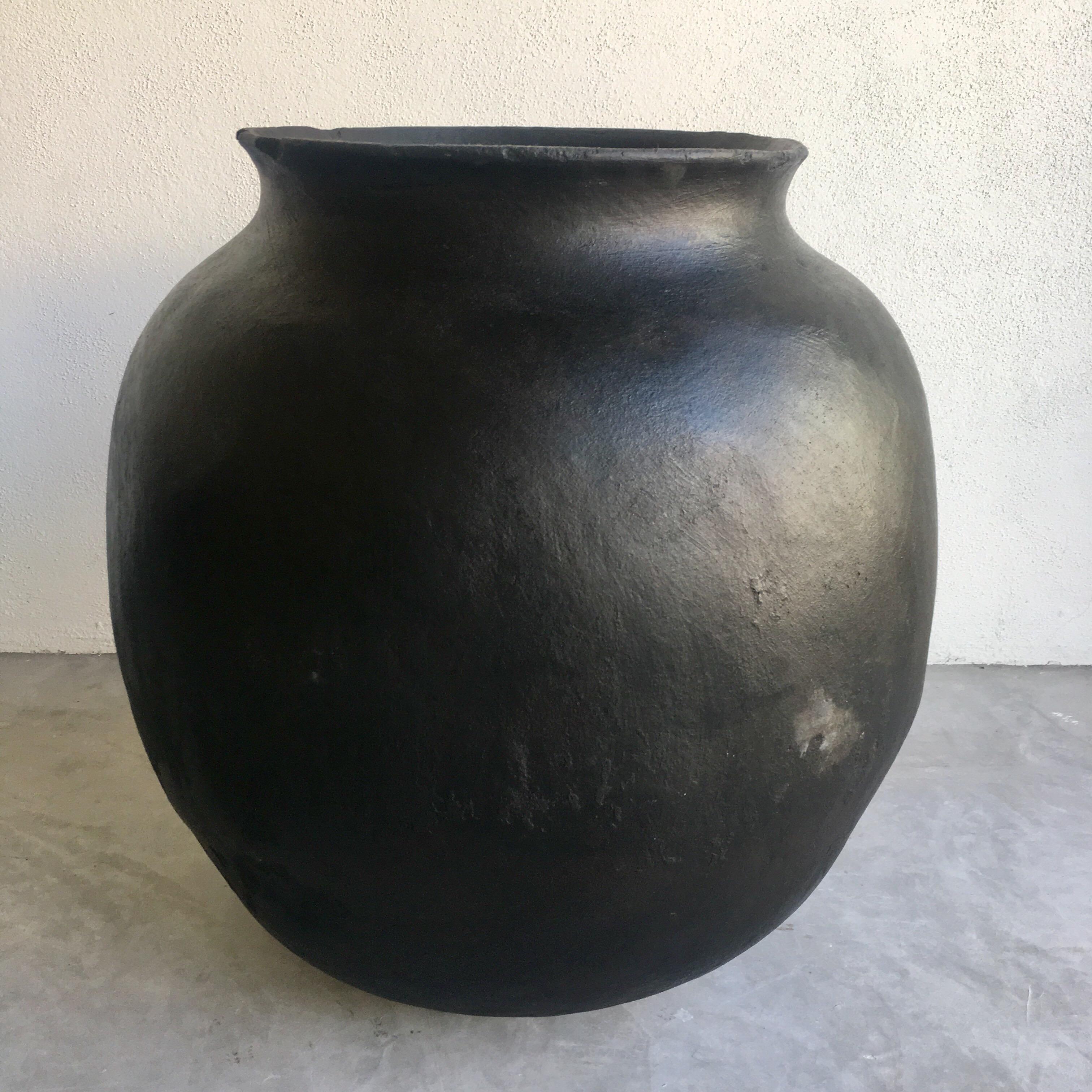 Blackened ceramic water pot from the Sierra Madre mountains of Michoacan, Mexico. Hand coiled.