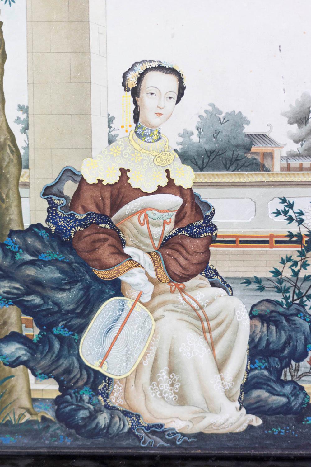 Watercolor on paper figuring a European young woman dressed in the Chinese style sat on a tree stump, on a terrace, next to a tree. Background with a decor of a Chinese palace, trees and a blue sky.

Black lacquered wood frame.

Work realized in