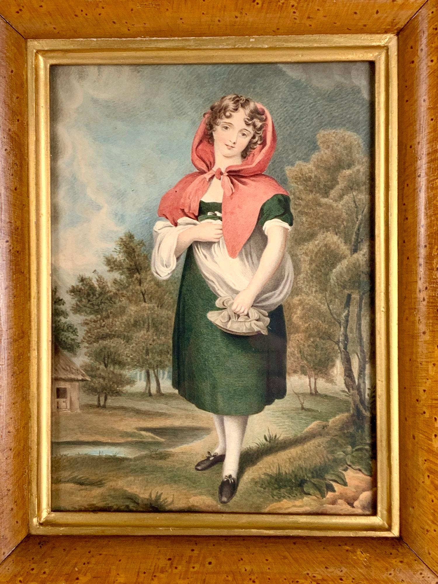 This exceptionally well-painted watercolor depicts a young lady wearing a blue dress and a red shawl.
Hand painted circa 1840-1850 the painting showcases high-level artistry in portraying her face, outfit, shoes, and stance.
The young lady stands in