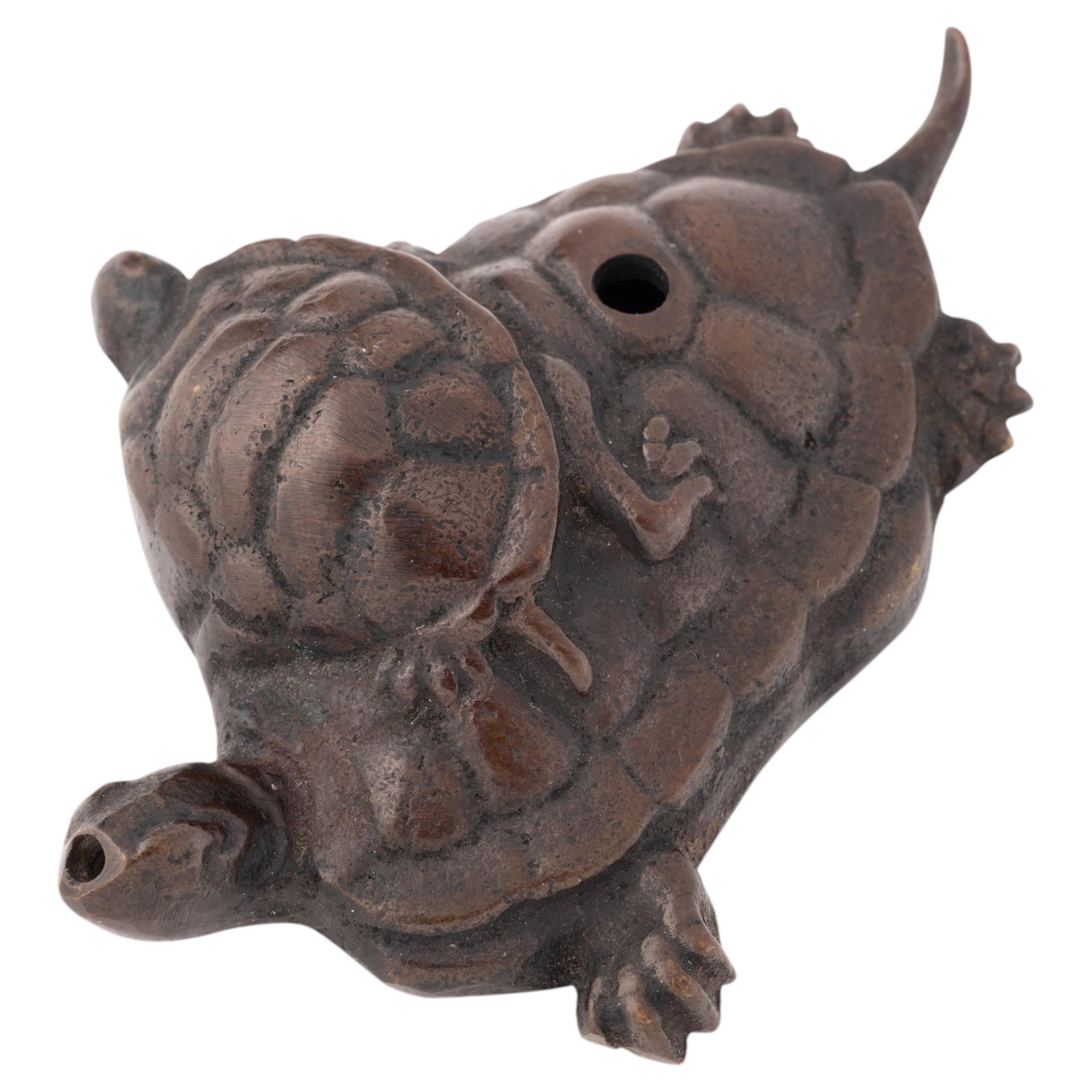 Waterdropper or suiteki in bronze in the form of a group of turtles