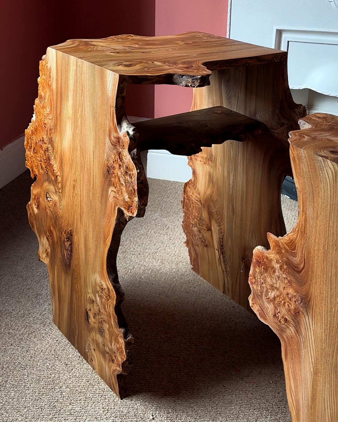 The Burr Elm waterfall bedside table / night stand is made up of one singular waney edge board. 
The board is cut into three pieces, then re-joined at 45 degree angles so that the grain and detail on each piece flows and interconnects from one side