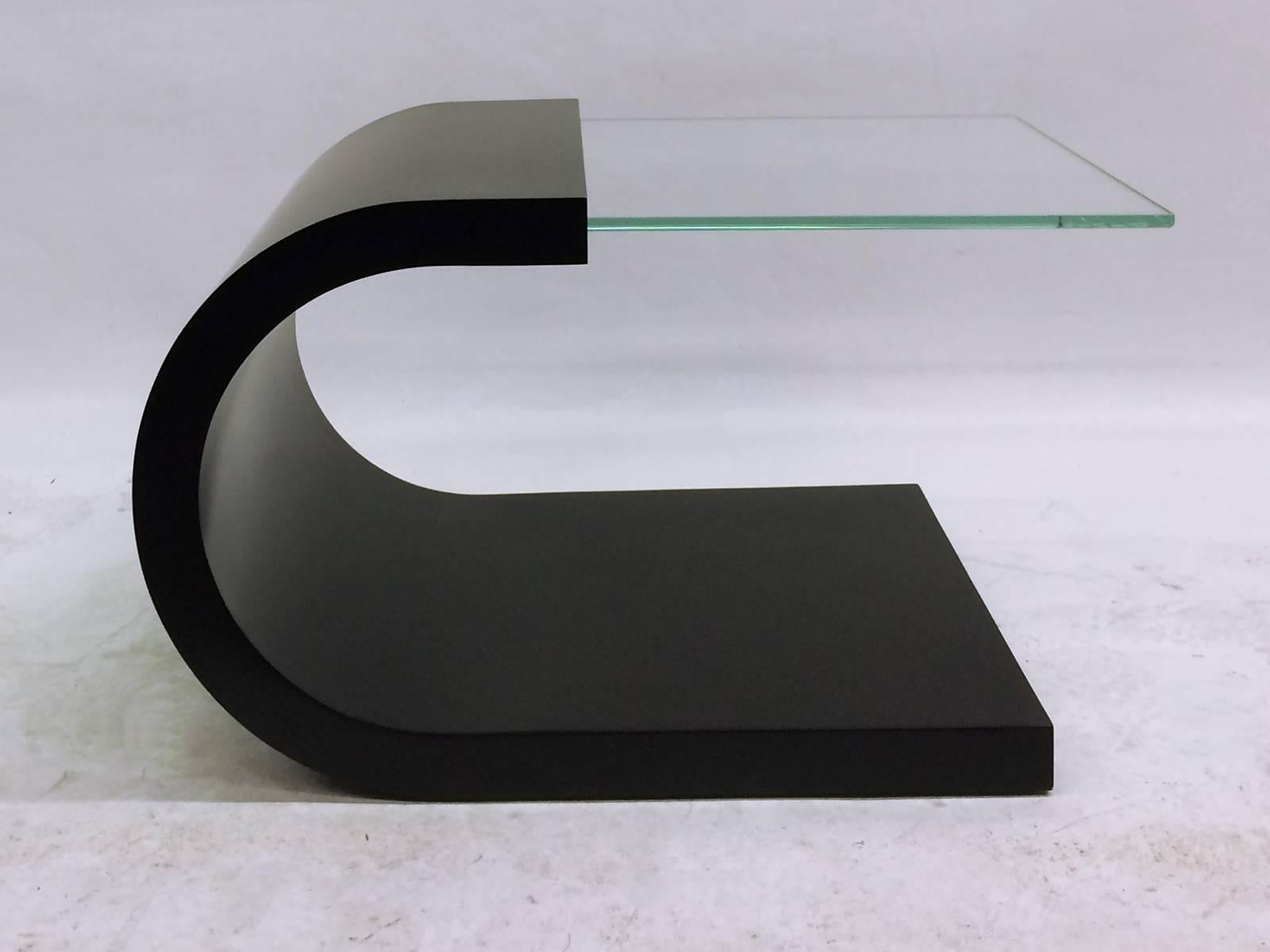 Waterfall black lacquer and glass end table.