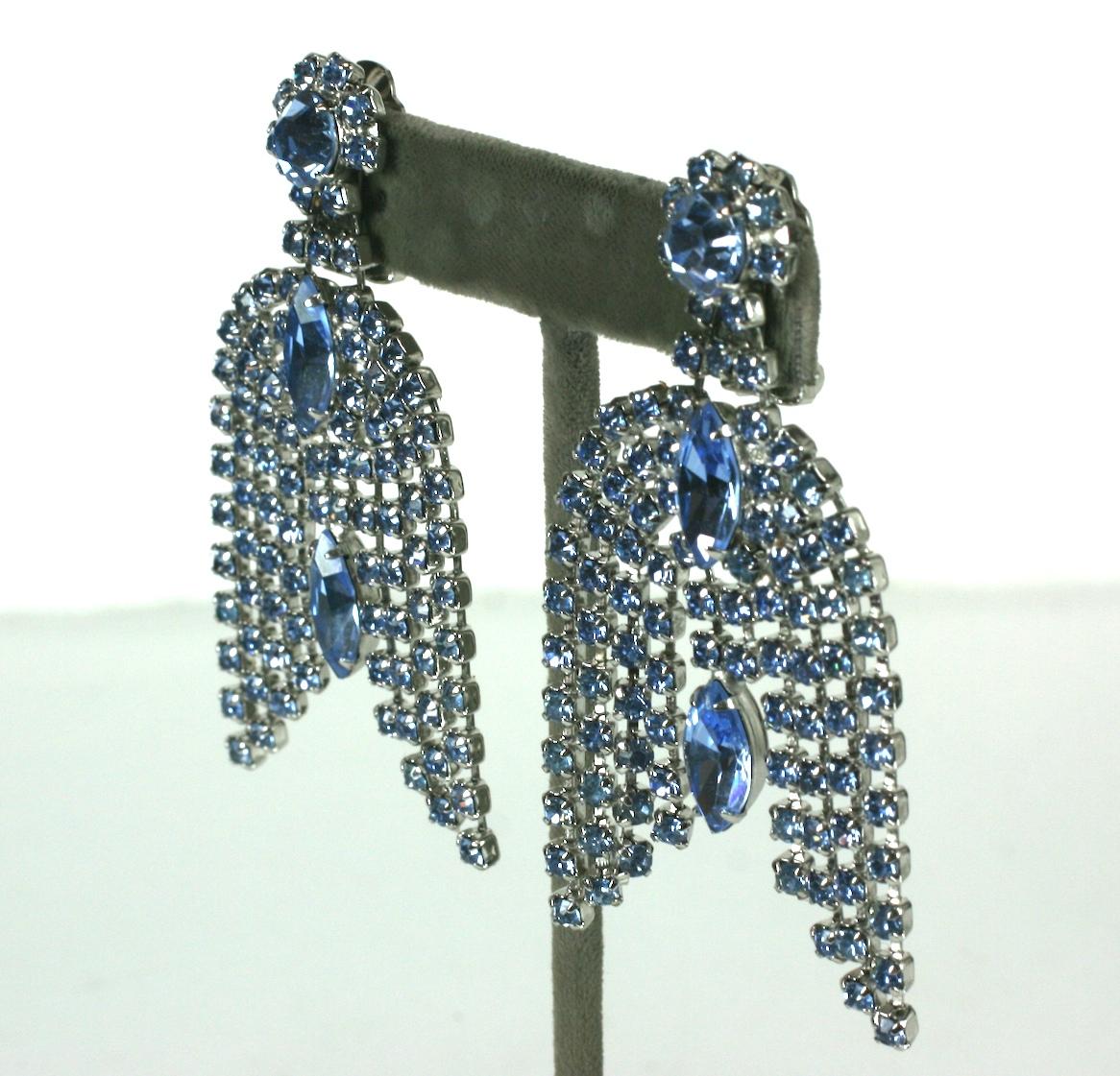Waterfall ear clips of pale sapphire prong set articulated crystal pave chain and large pale sapphire marquise faceted stones. Suspended from crystal rhinestone flower head and set in silver plated metal. Clip back fittings. 
Excellent Condition,