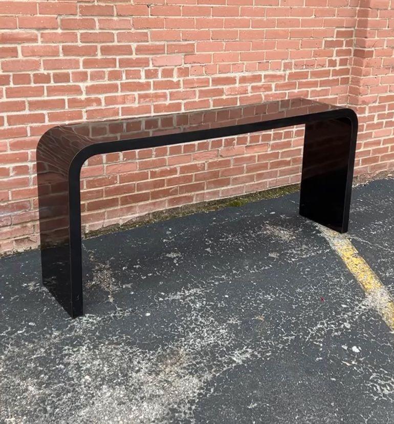 black waterfall console table