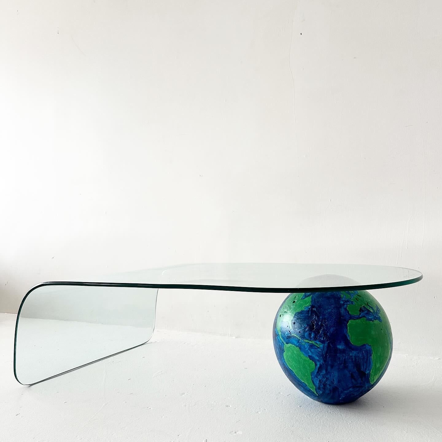 vintage waterfall glass coffee table with plaster sphere counterbalance base that has been painted like a globe