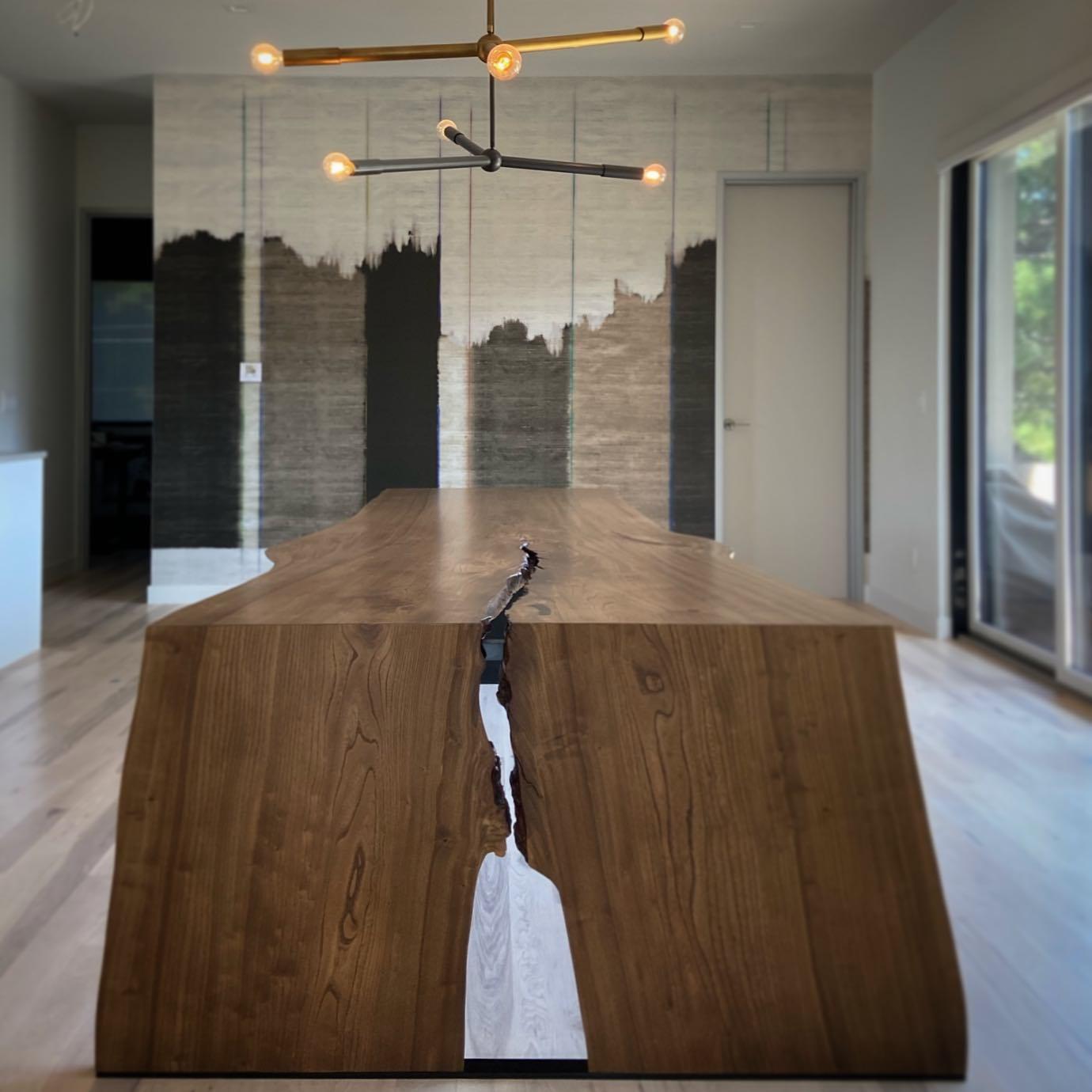 An incredible 14ft Siberian elm slab that we took and created one waterfall leg - so the grain is continuous up the leg and along the top, and one solid steel slab leg. You can order it in any size, and wood, any finish etc...

The table in the