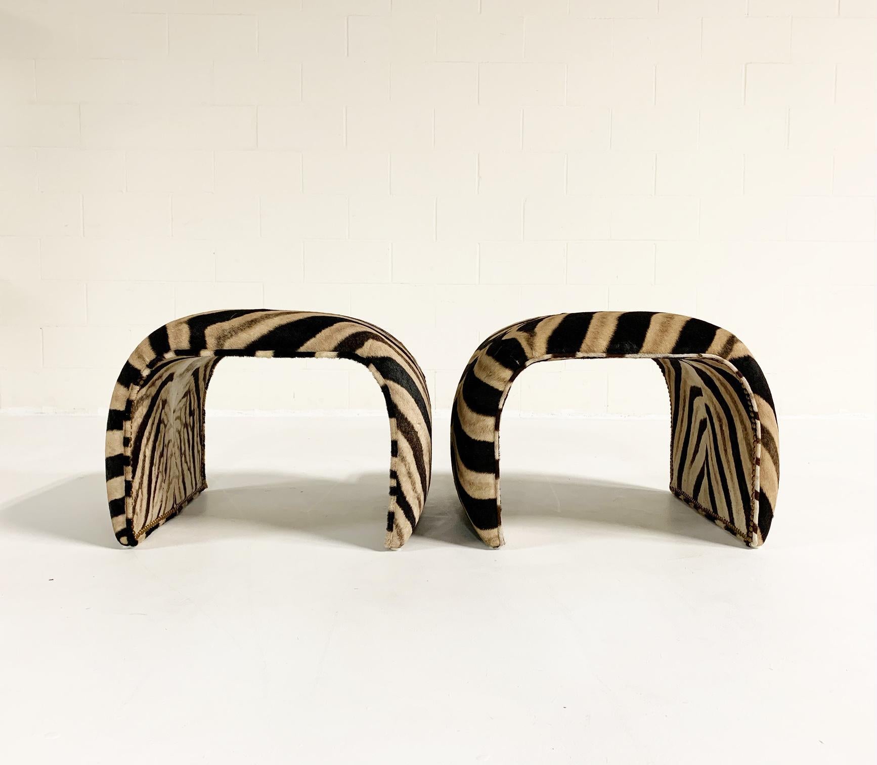 Private listing for Marybeth. 

We collected and will restore and reupholster a pair of vintage waterfall ottomans in zebra hide. Images on this listings are another pair of vintage waterfall benches. Customer has chosen the vintage ottomans that we