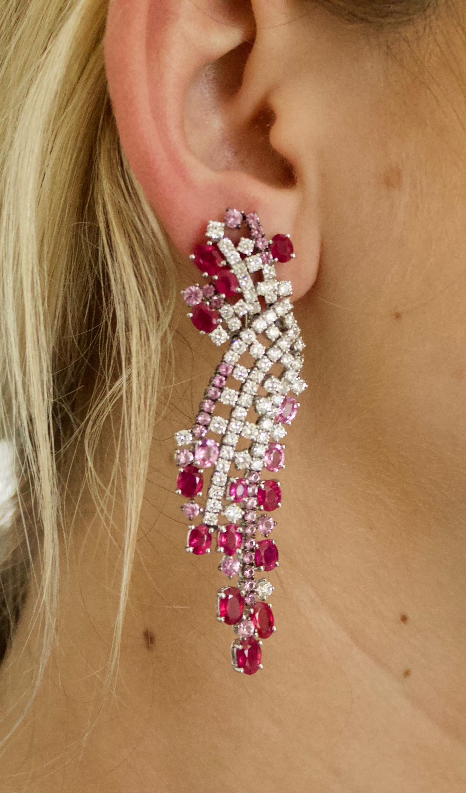 Waterfall Ruby and Pink Sapphire Diamond Earrings 
Twenty Six Cut Oval Rubies and Pink Sapphires weighing 13.03 carats approximately [bright with no imperfections visible to the naked eye]
Sixty Four Round Pink Sapphires  weighing 3.02 carats