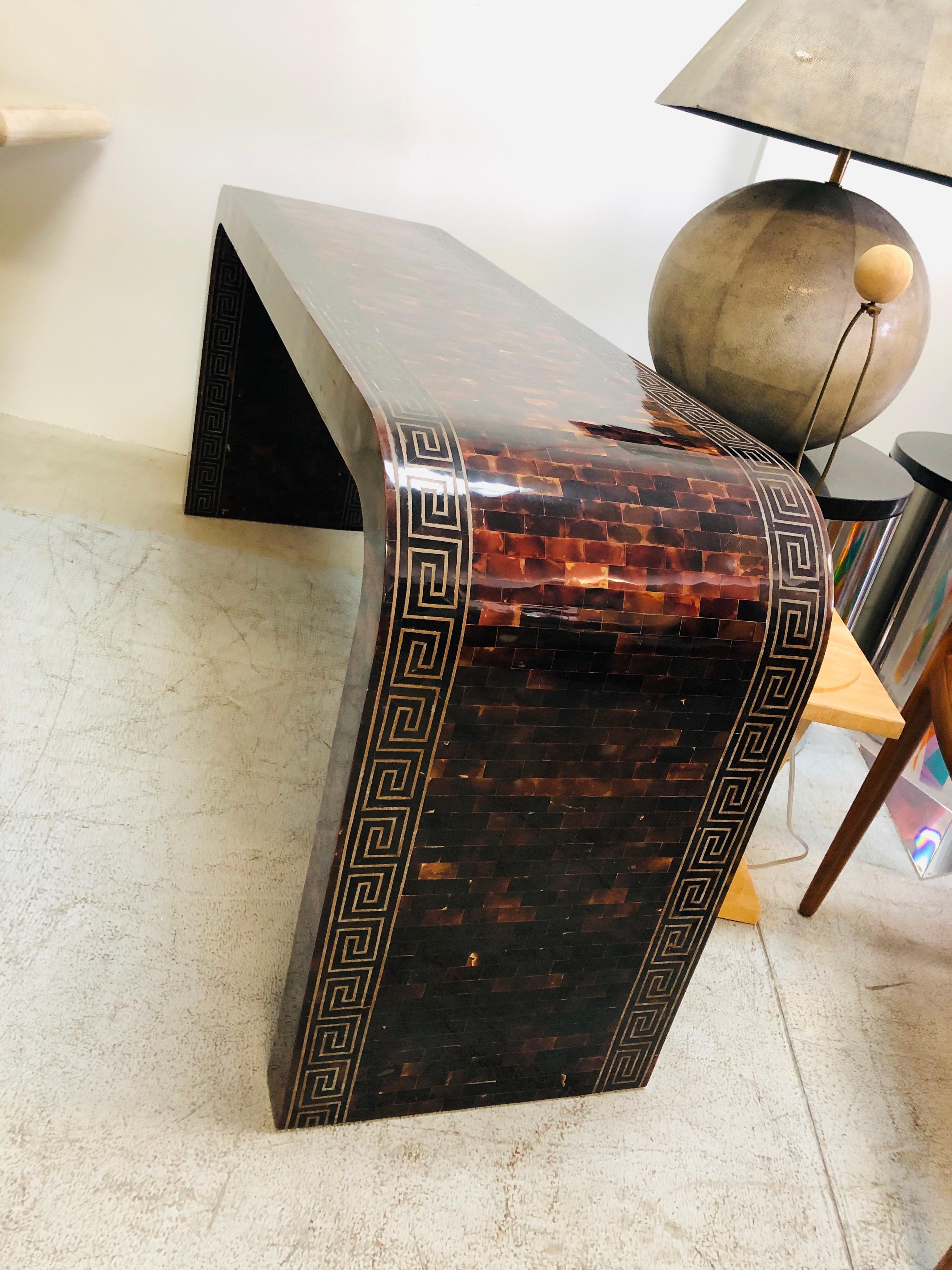 A waterfall console table. Tessellated pieces with crisp inlaid brass design. The Greek key design is very detailed and in present even on the inside of the bases. Beautiful original condition. 25% off sale