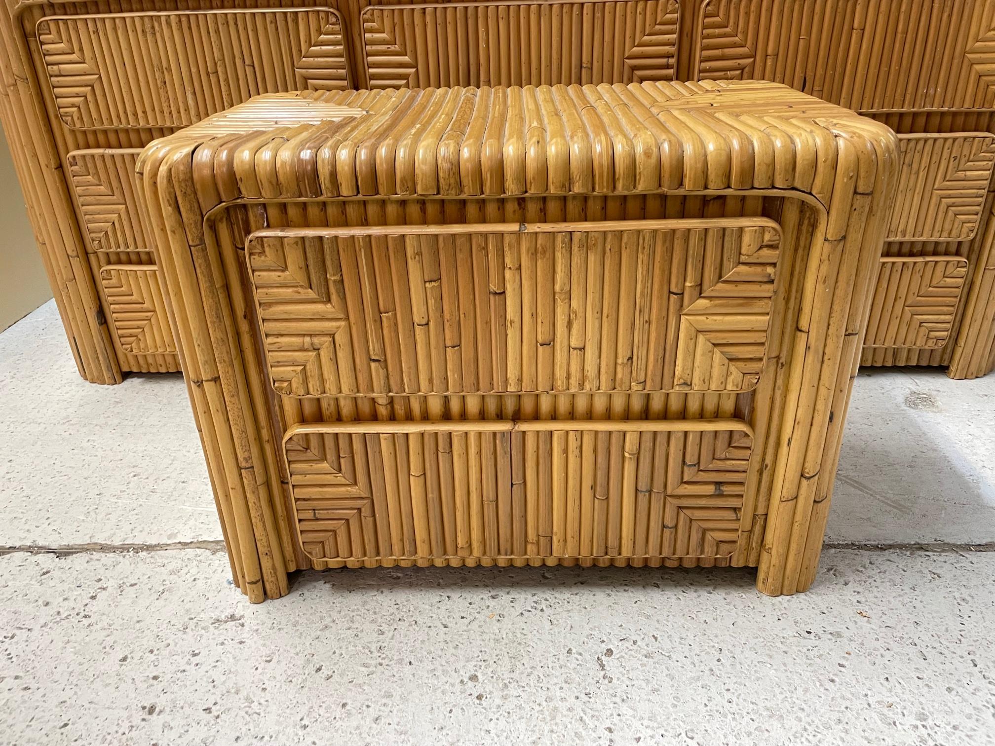 Vintage 3-drawer waterfall night stand features full veneer of split bamboo and geometric drawer front detailing. Good vintage condition with minor imperfections consistent with age.


 