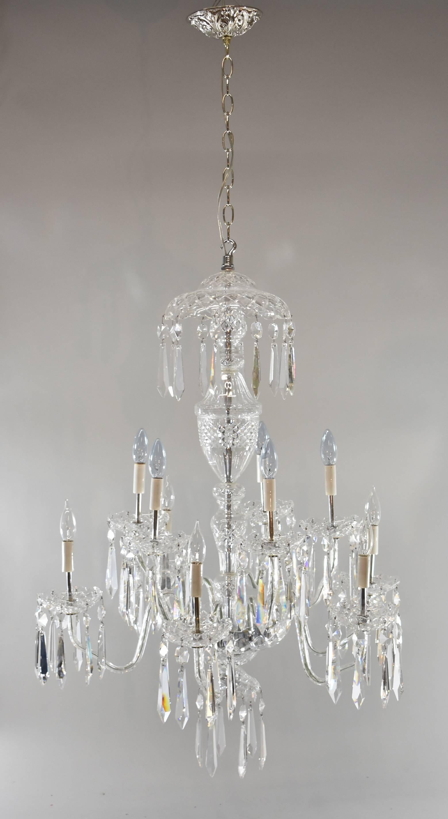 An impressive ten-arm crystal chandelier by Waterford. The Waterford Avoca ten-arm chandelier is double-tiered and features Waterford's Avoca crystal pattern. The beautiful A10 Waterford Crystal chandelier has a crystal center column and is