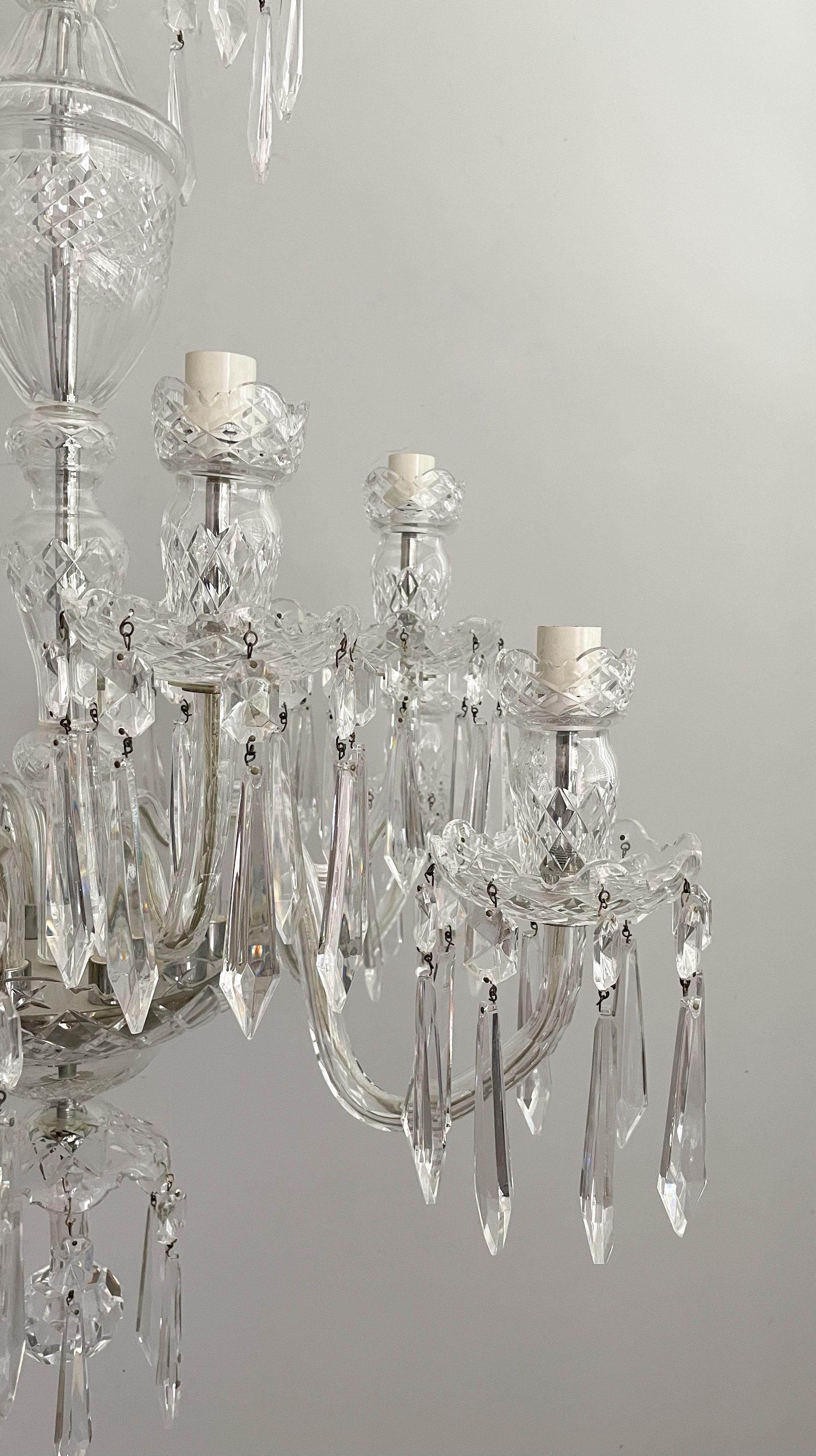 Exquisite, vintage Waterford Crystal 10 light “Avoca” chandelier. 

The chandelier features beautiful cut crystal details throughout this two tier design. The “Avoca” light fixtures are some of the most sought after designs from the now