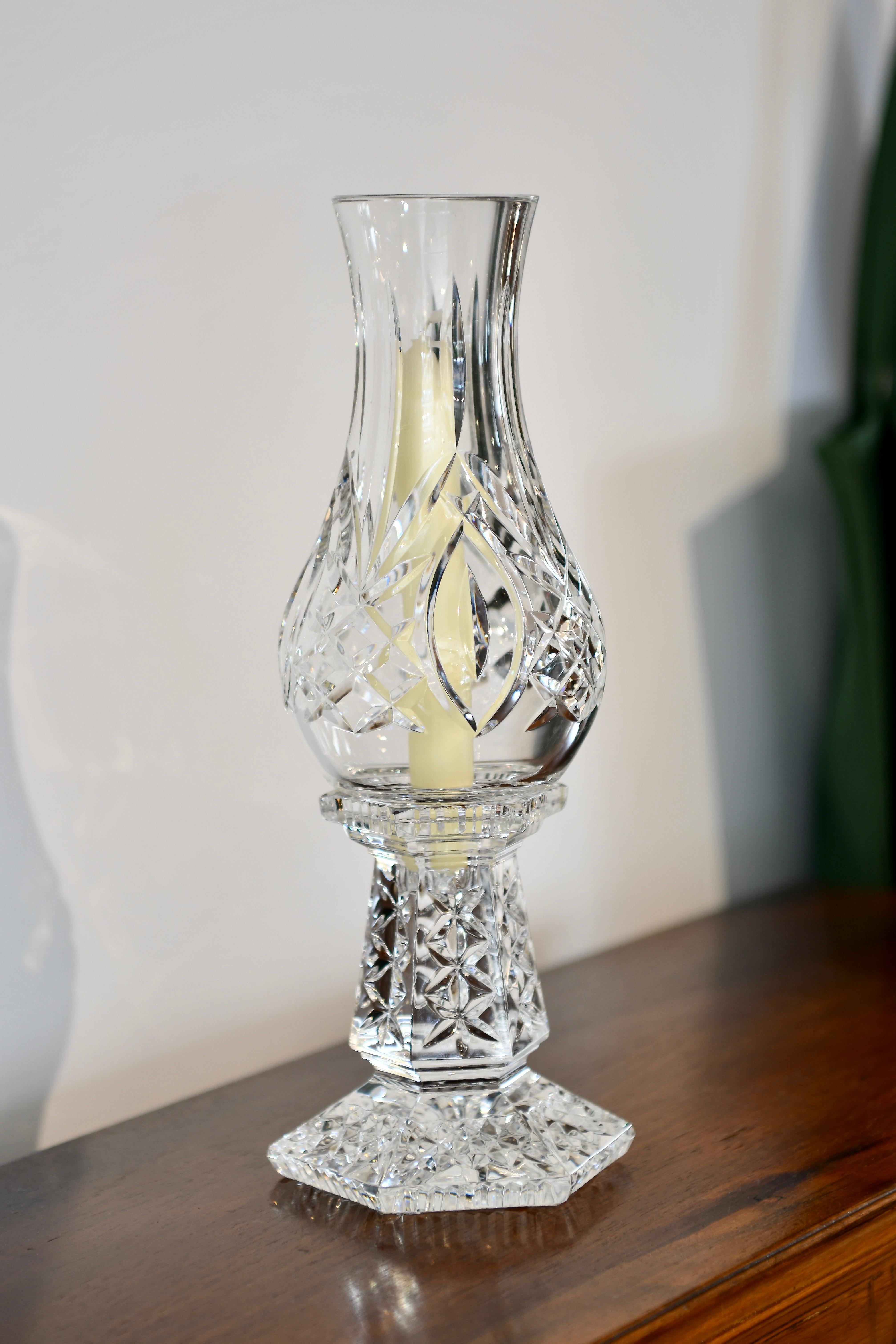 Waterford signed candlestick with hurricane shade. Two available, sold individually. Dimensions: 13