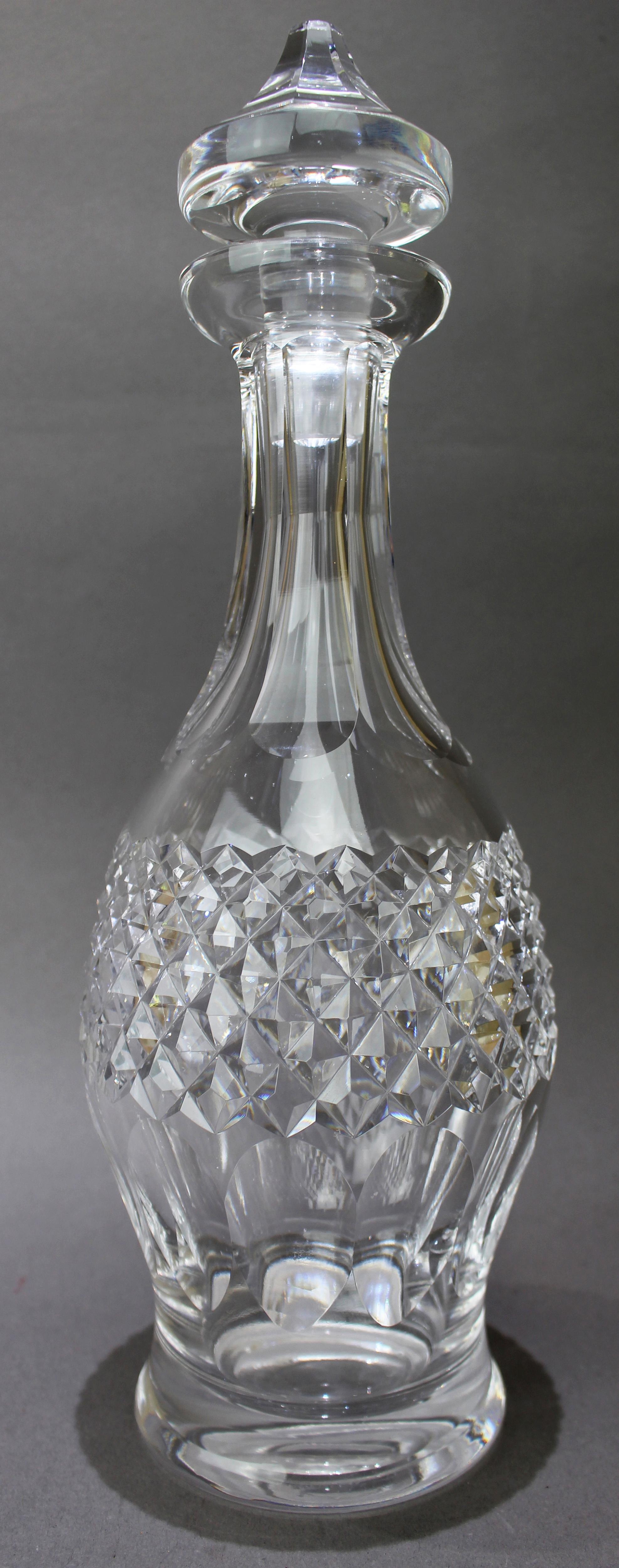 Waterford Crystal “Colleen” Pattern Decanter

A fine quality Irish cut crystal decanter by Waterford, in the elegant Colleen pattern. The design features a richly faceted diamond-cut midsection above fluted lower panels and a tall, tapering neck