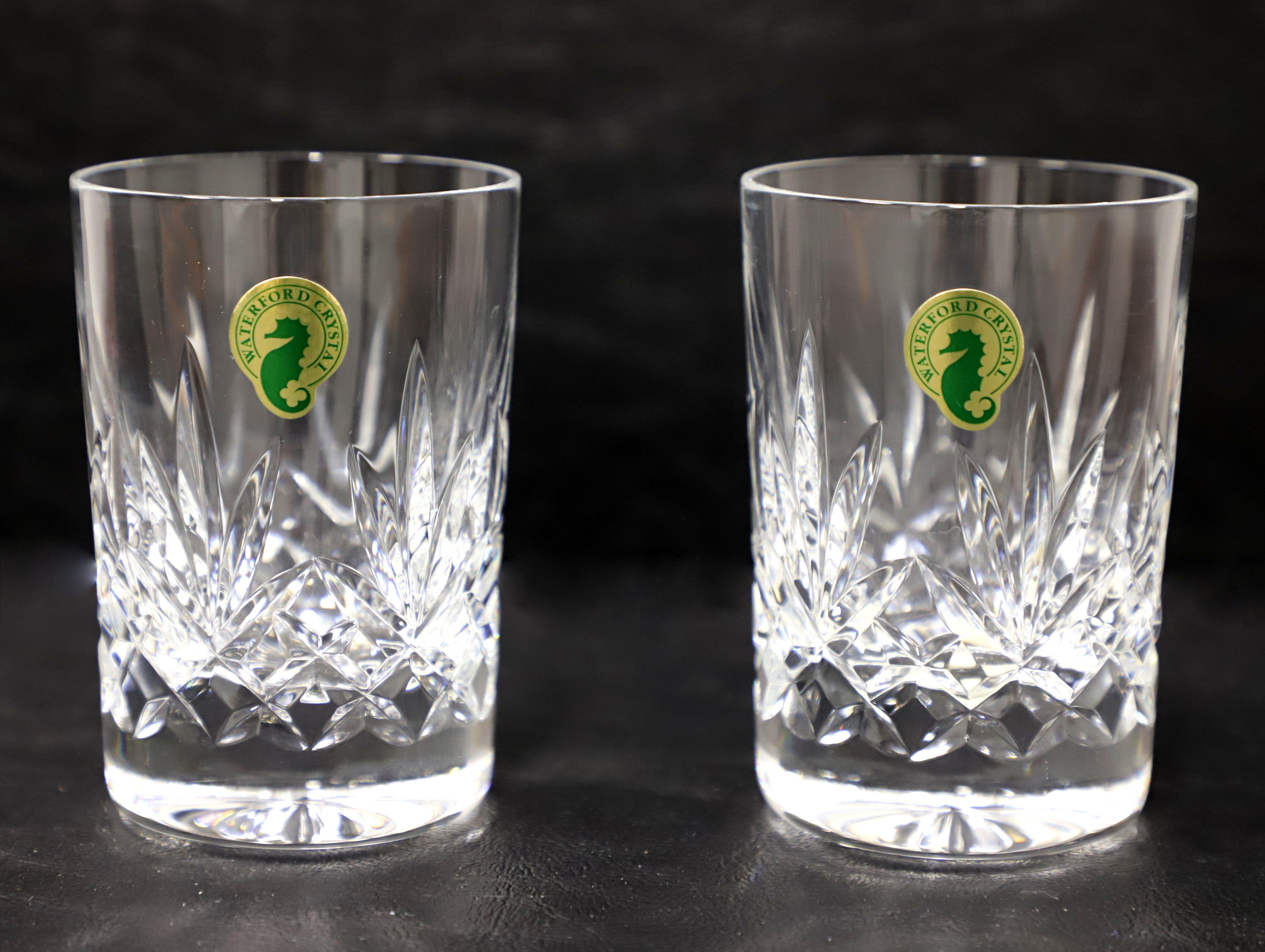 A pair of Early 21st Century juice tumblers by Waterford, their 