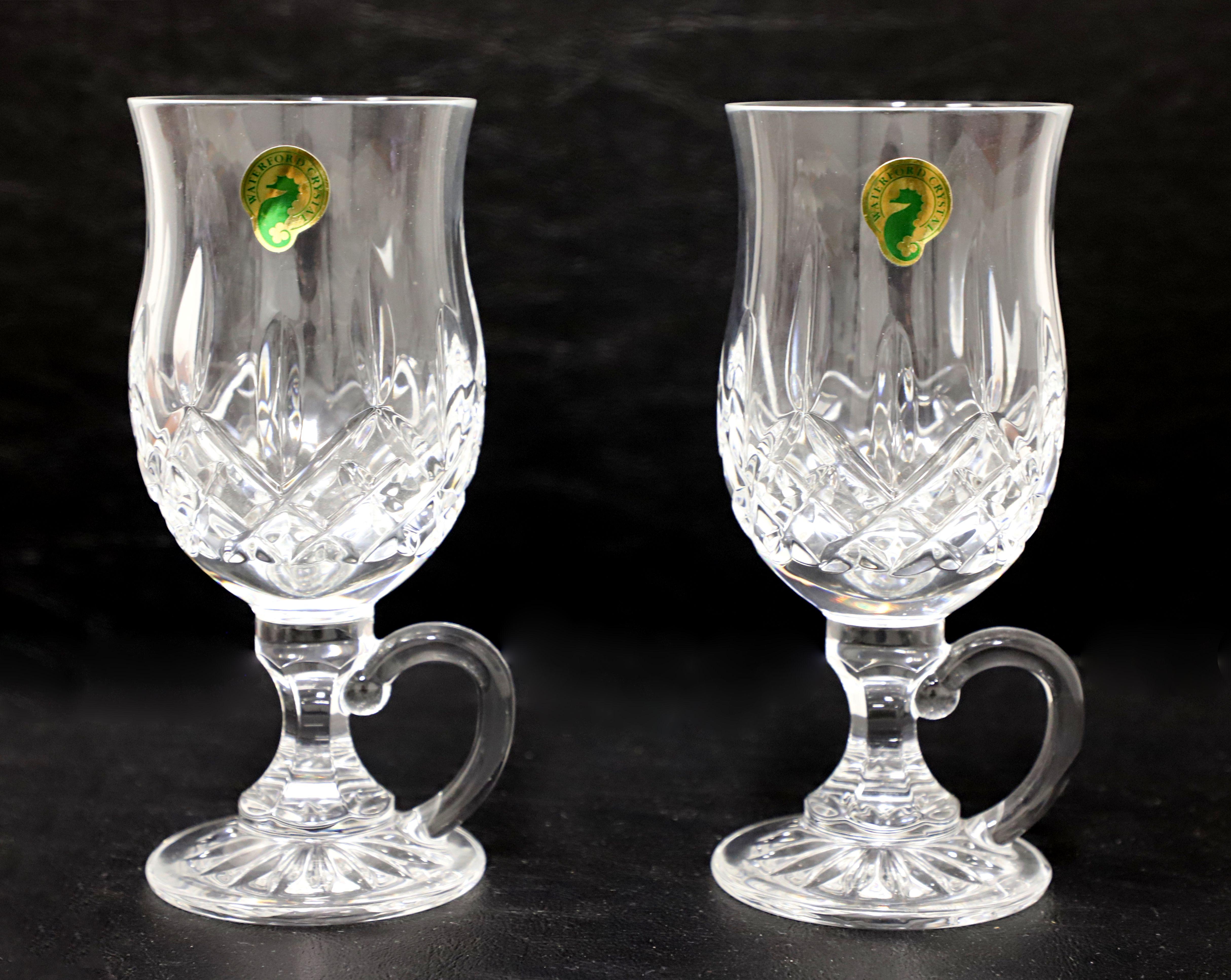 A pair of Early 21st Century Irish coffee mugs by Waterford, their 