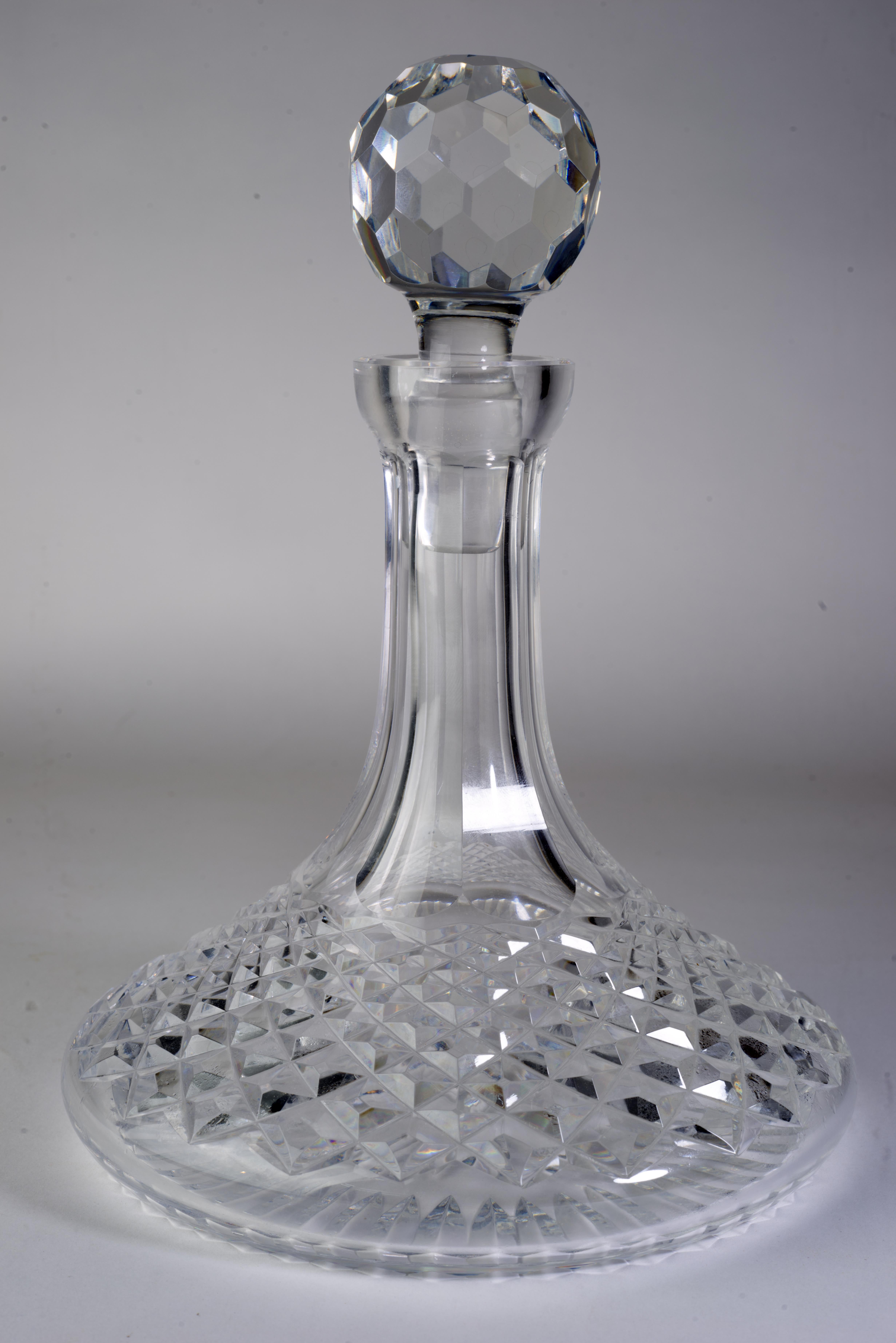  Vintage cut crystal ships decanter with stopper was made by Waterford in Alana pattern. The pattern was manufactured from 1952 to 2022; it is characterized by cut cross hatch with multi-sided stem.

The decanter is signed with etched Waterford mark