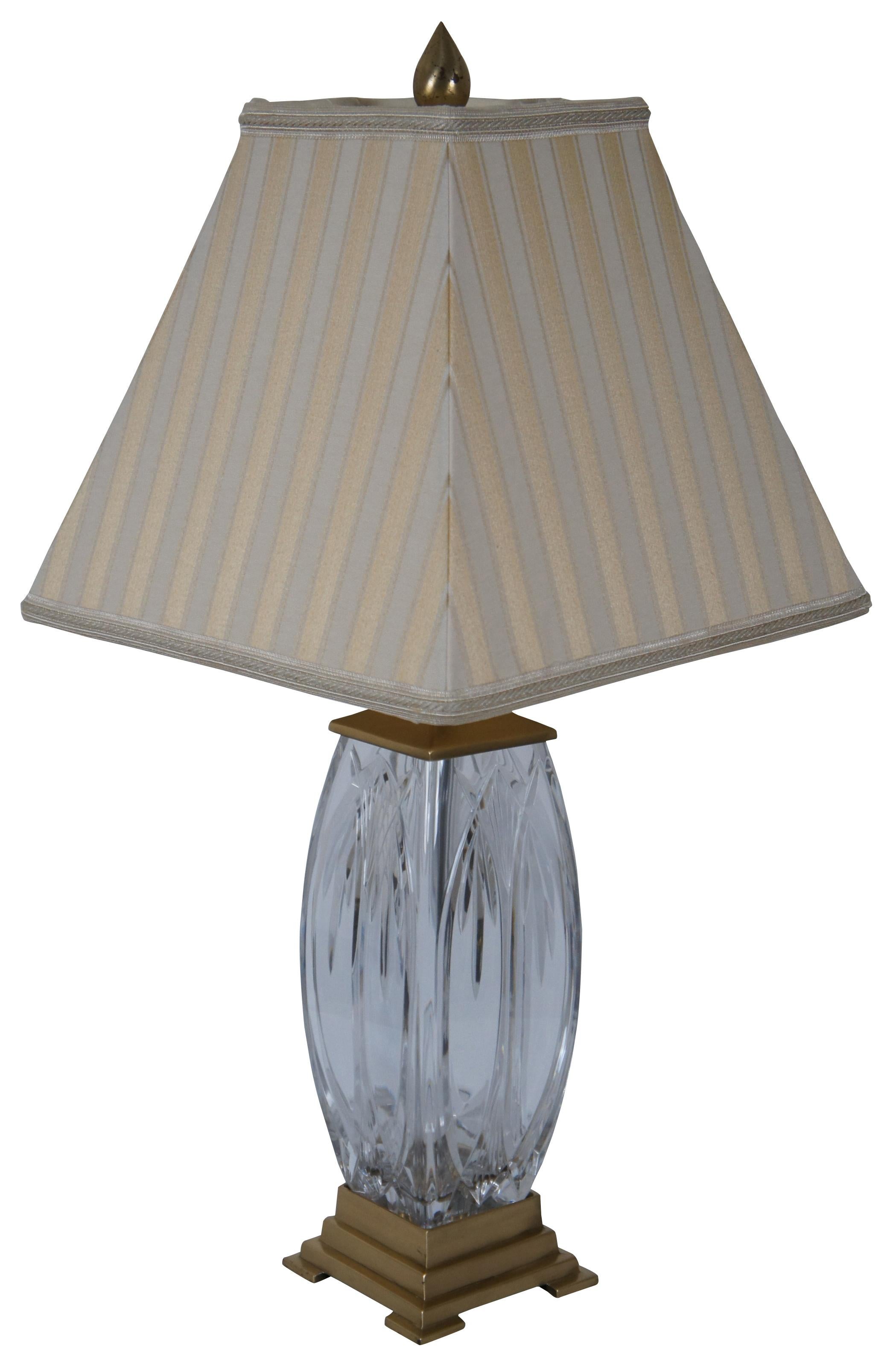 Waterford Finn cut crystal and Versailles brass table lamp with striped silk shade. 108-892-19-00

Measures: 4.75” x 4.75” x 18” / shade - 12.25” x 12.25” x 10.5” / height to top of finial – 26” (width x depth x height).
