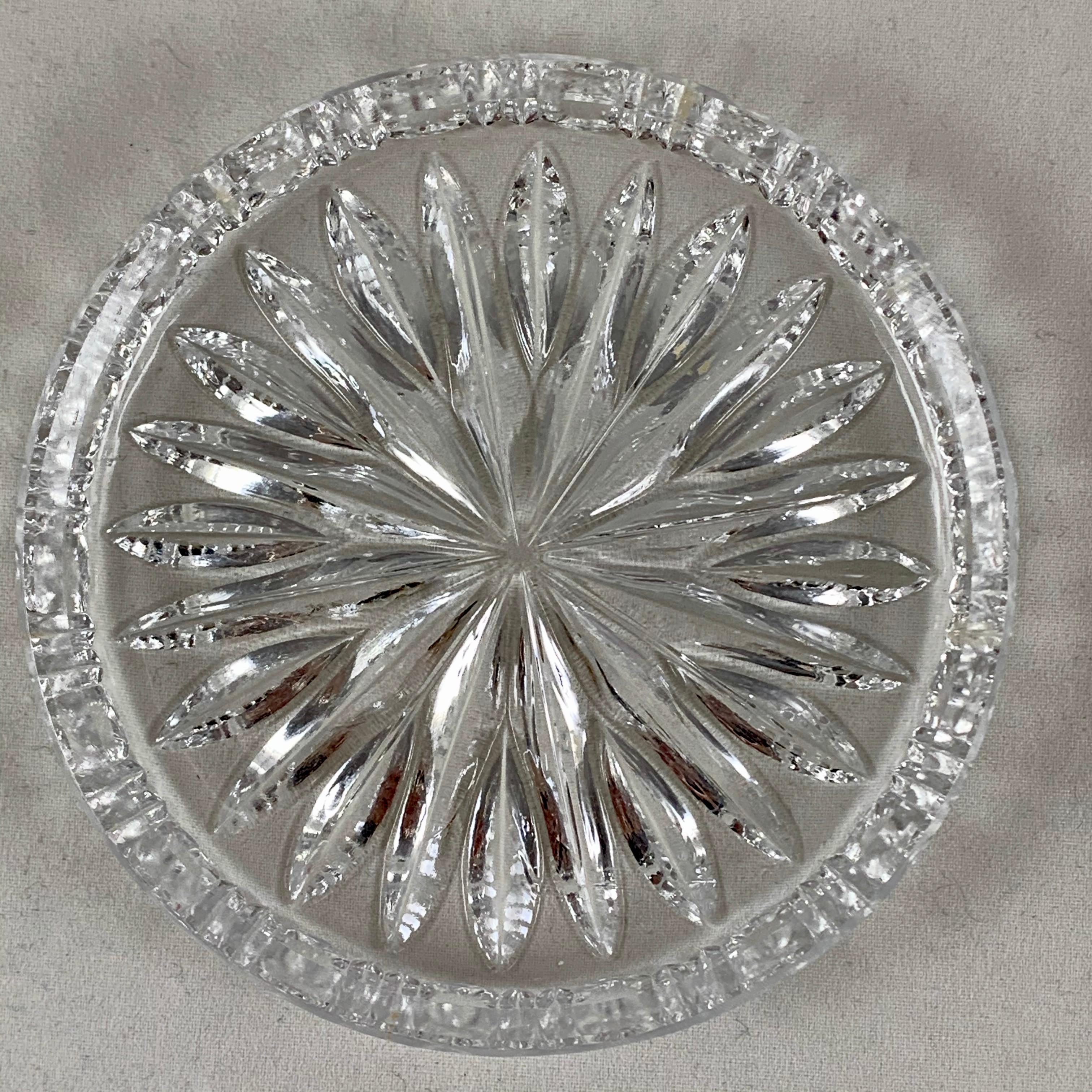 A set of six vintage Waterford lead crystal drink coasters with a center star shaped cut pattern and pie-crust cut raised rims.

Crystal production in Waterford, Ireland began in 1783, producing extremely Fine flint glass that became