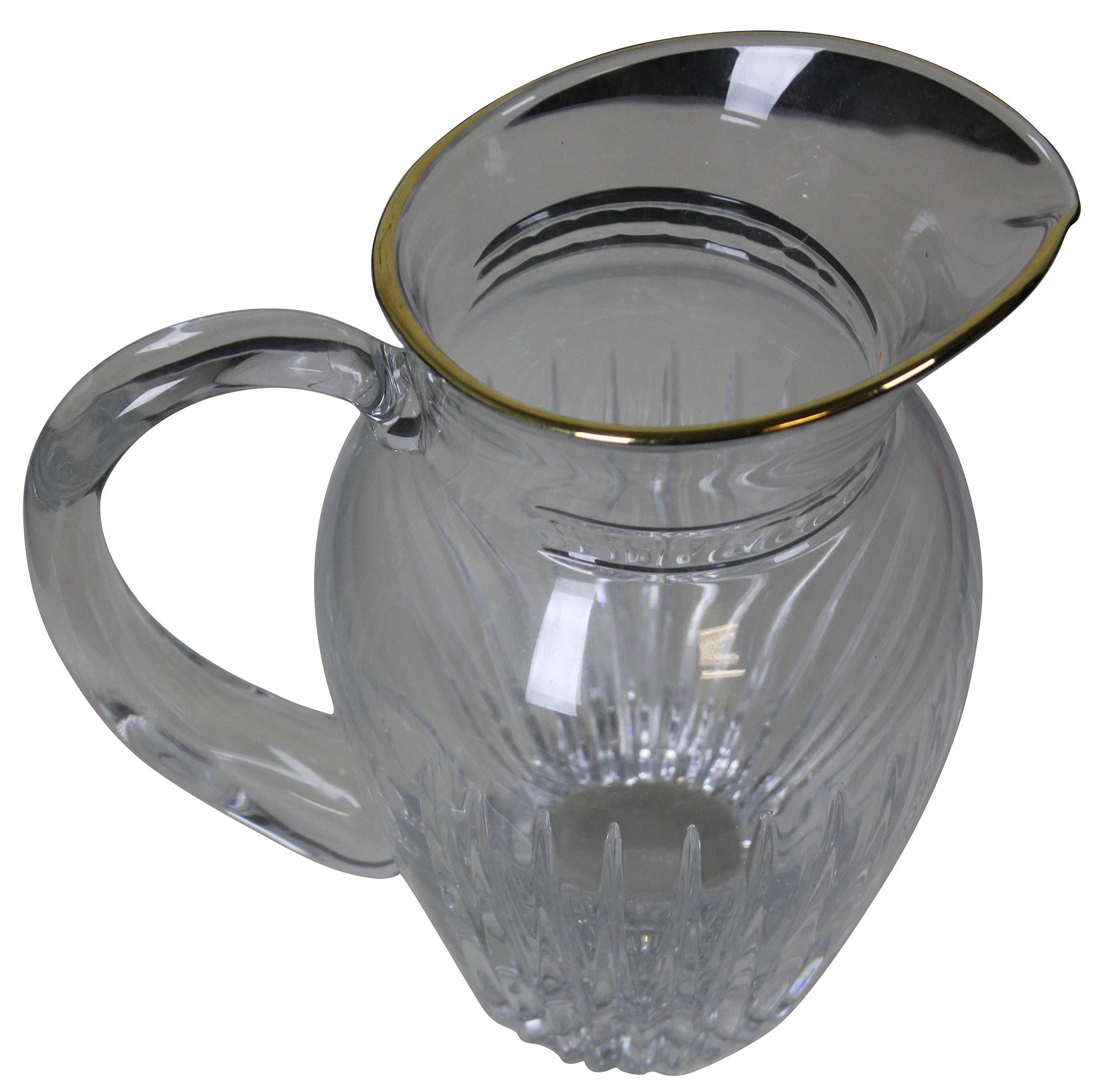 Vintage Hanover Marquis pattern pitcher by Waterford. Features a gold rim and vertical cut. Marquis Crystal is manufactured by the Waterford Crystal Company in Waterford, Ireland, and also in Germany and Slovenia. The Hanover Gold pattern is a