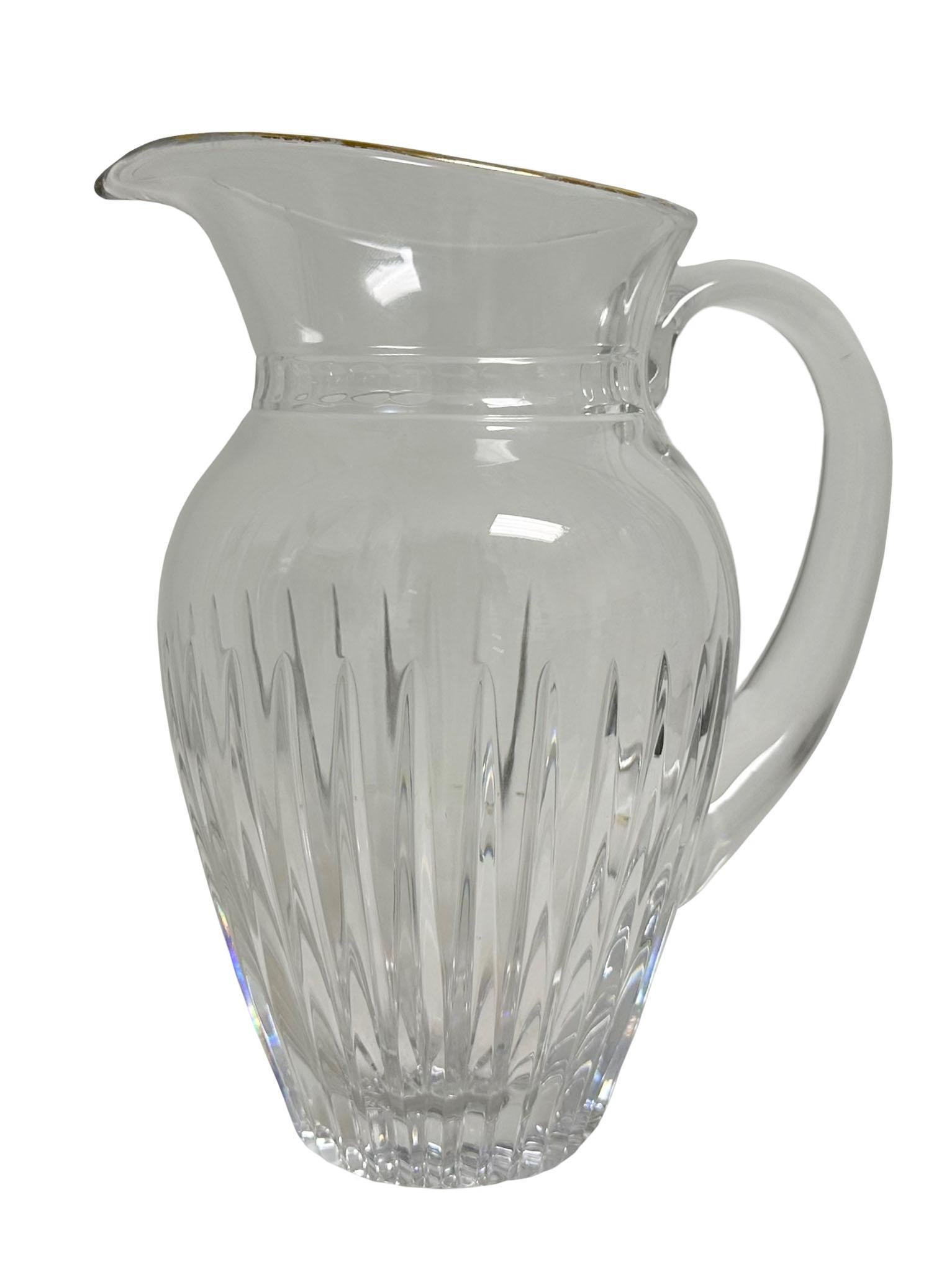A beautiful vintage Waterford pitcher signed by Waterford and the artist. Has a gold rim around the top which is unusual. England, circa 1950s.