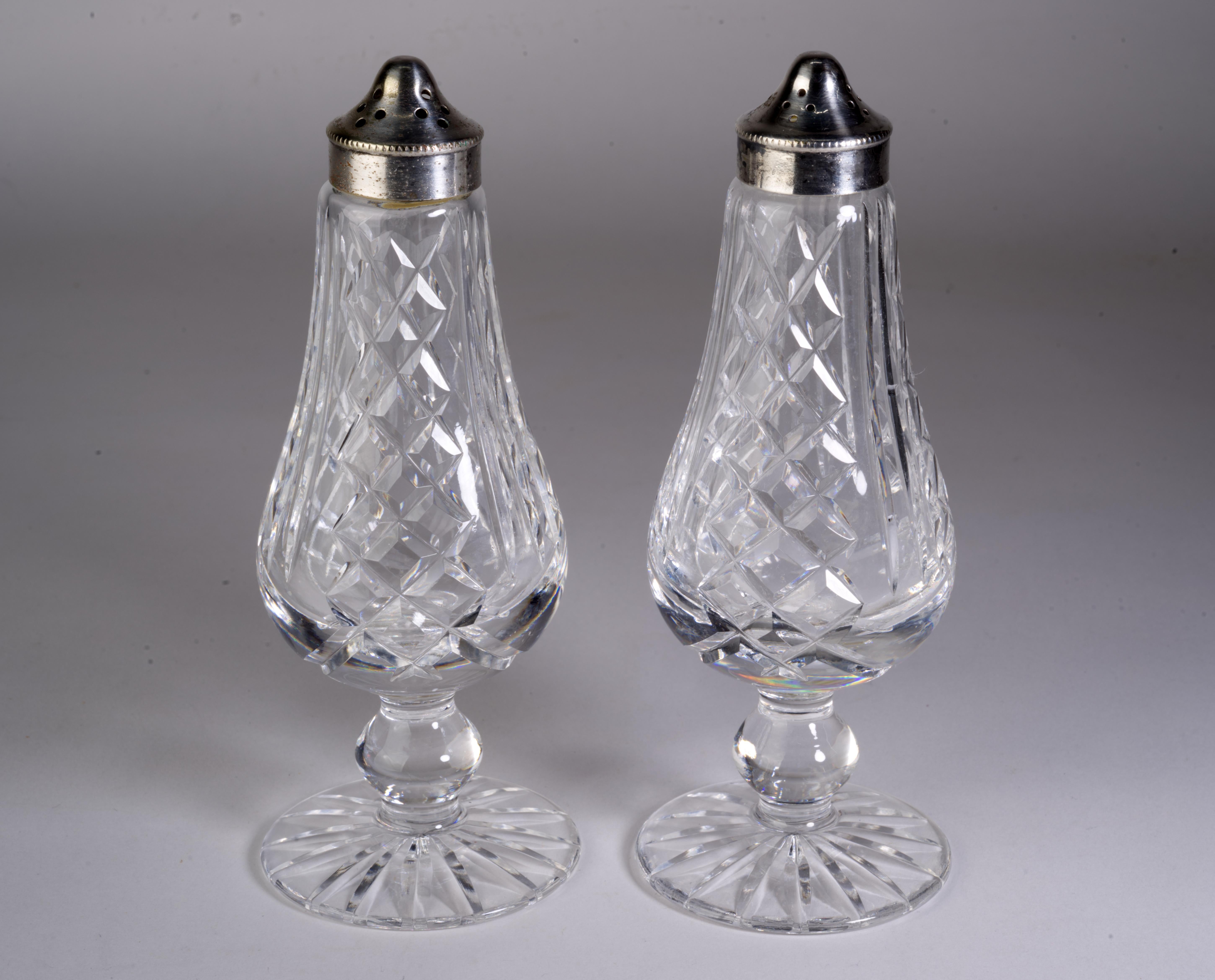  Vintage Waterford Crystal salt and pepper shakers were made in Republic of Ireland of cut crystal with silverplate covers. Glendariff pattern is characterized by vertical cuts and stacked cut X's with starburst cut bottoms; it was manufactured from