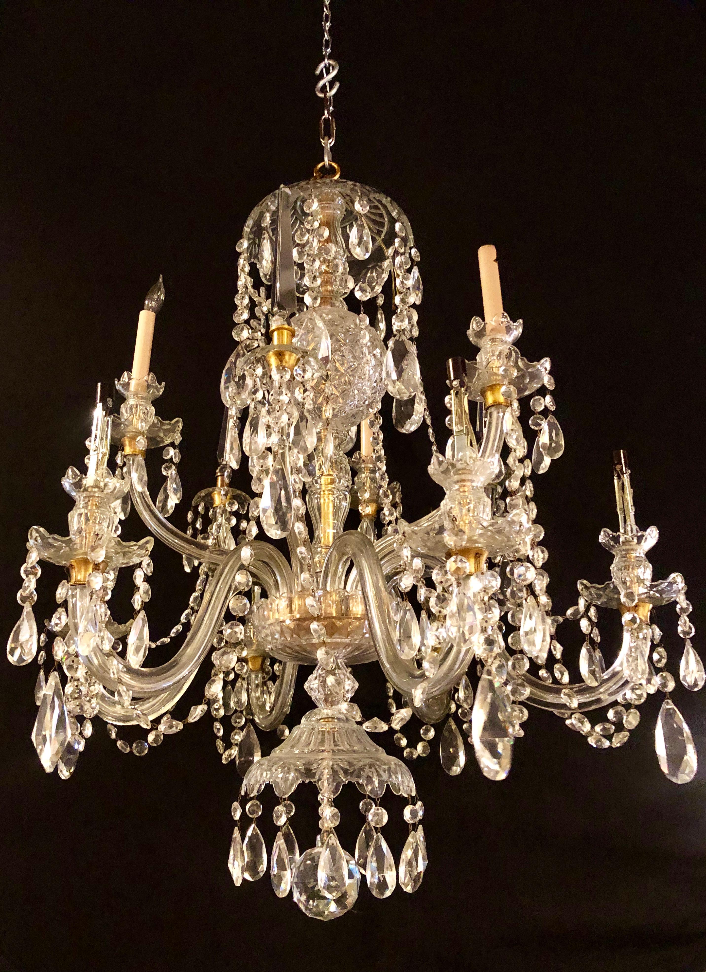 Waterford style 1940 cut crystal chandelier with palatial center column sphere. This large and impressive almost four feet high ten light chandelier is in fine condition and its presence is note shown in any photographs. The center column-form has a