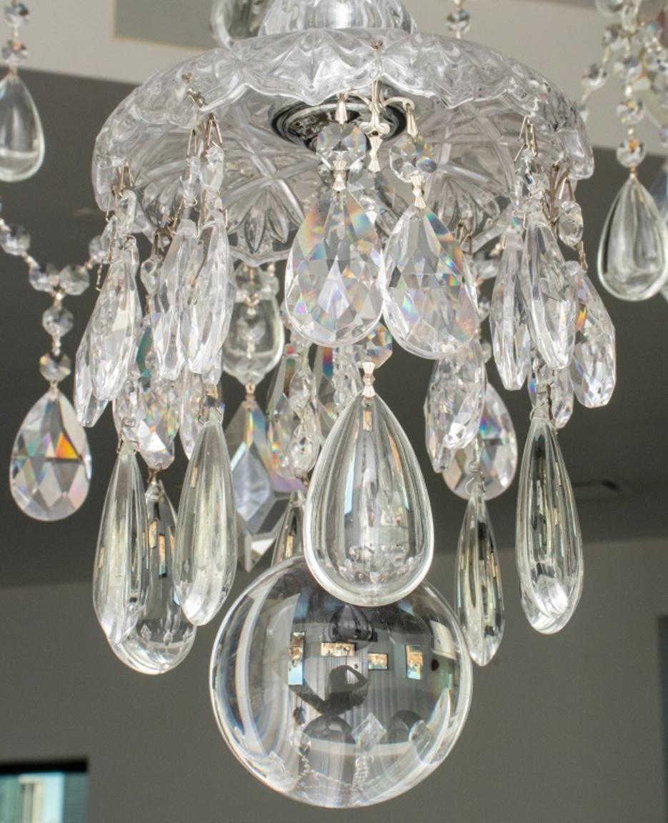 Waterford style Monumental crystal chandelier, in the Georgian waterfall taste with canopy, crystal chains, cut glass baluster-form supporting twenty candle arms in two tiers. In good condition. Wear consistent with age and use.

Dimensions: 72